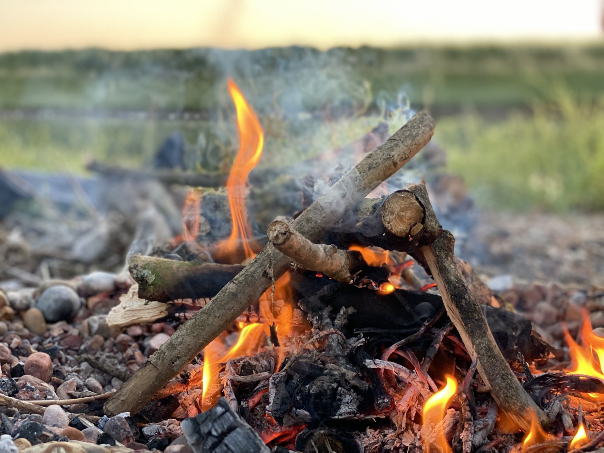 Open wood fire for weekend wild camps with NOMAD Sea Kayaking.