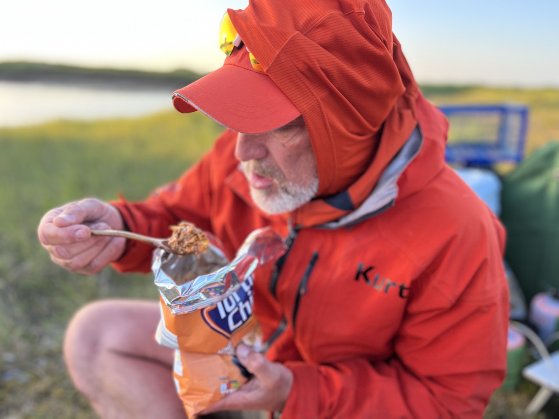 Lead Guide enjoying hot food at the end of a very long day with NOMAD Sea Kayaking.