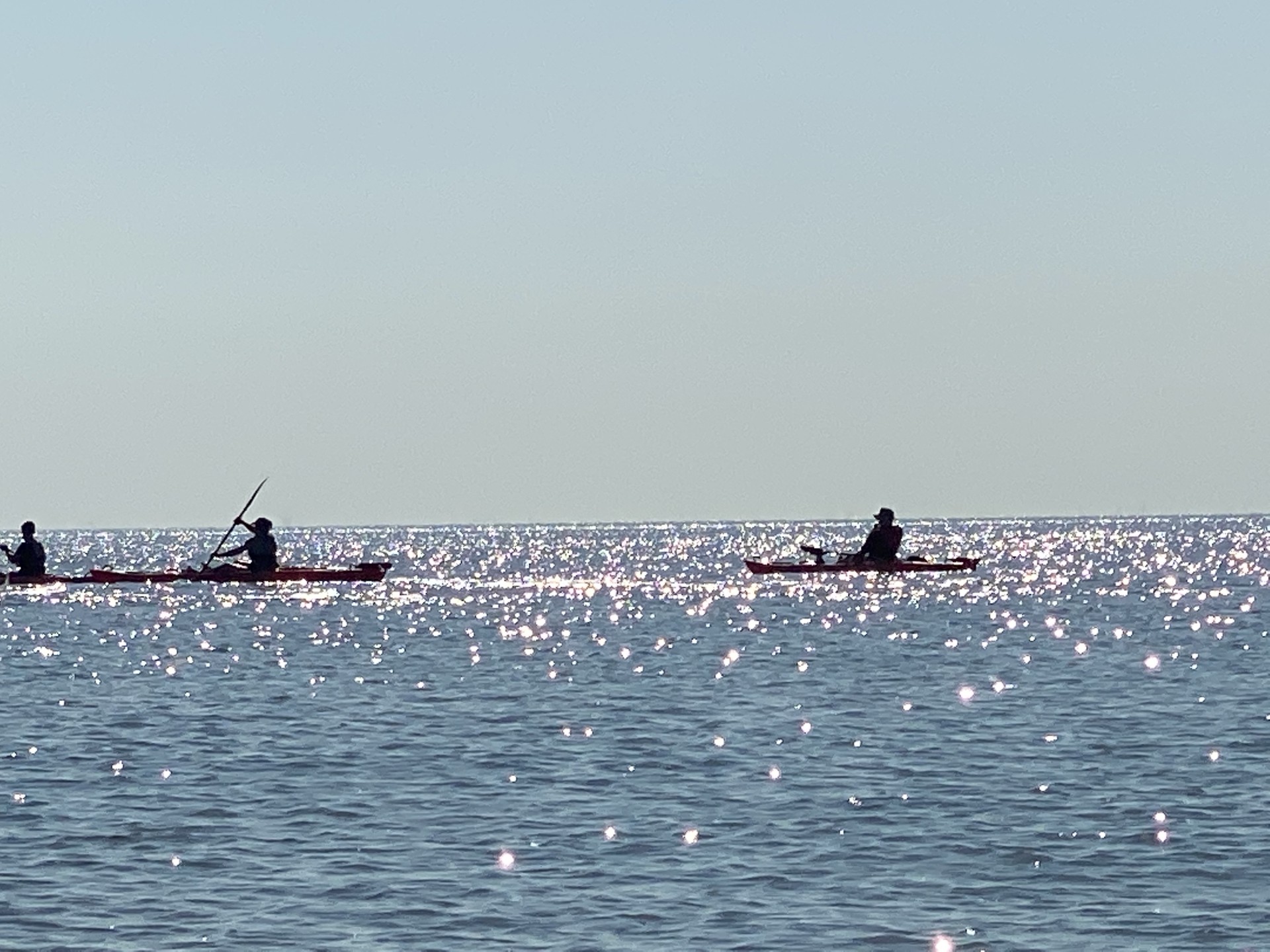 Kayakers on the water in Suffolk with NOMAD Sea Kayaking.