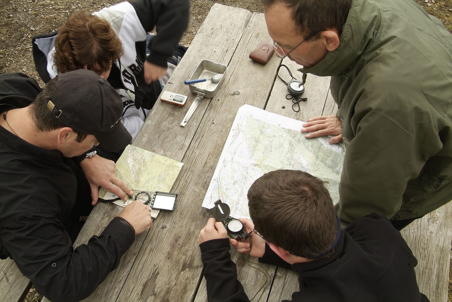 A small group practicing basic map and compass work for sea kayaking trips