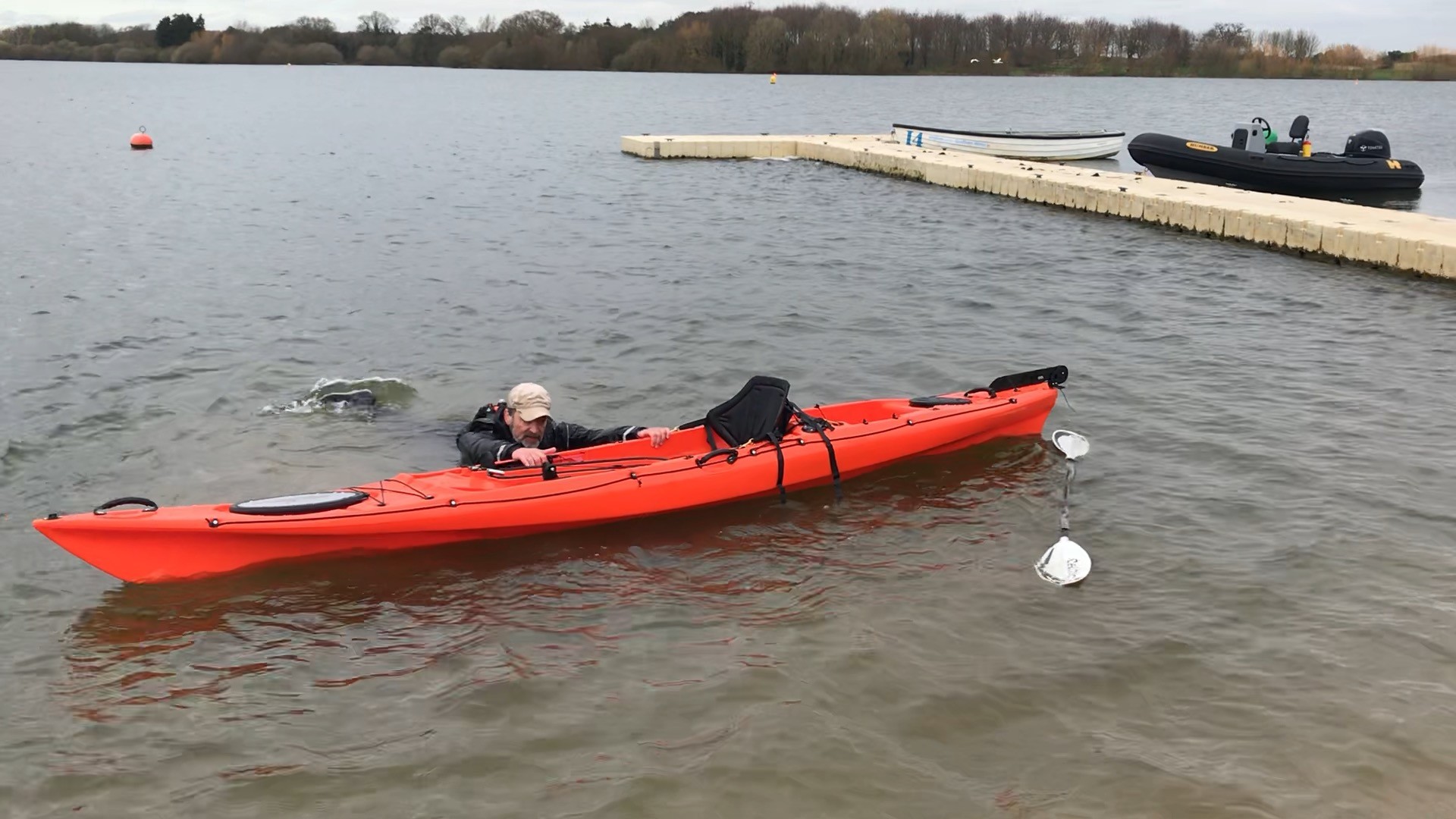 /storage/Coach recovering a large sit-on-top kayak
