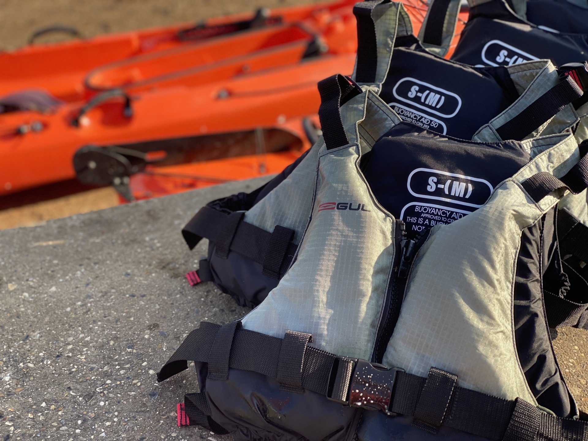 Buoyancy aids lined up ready to be issued to kayakers.