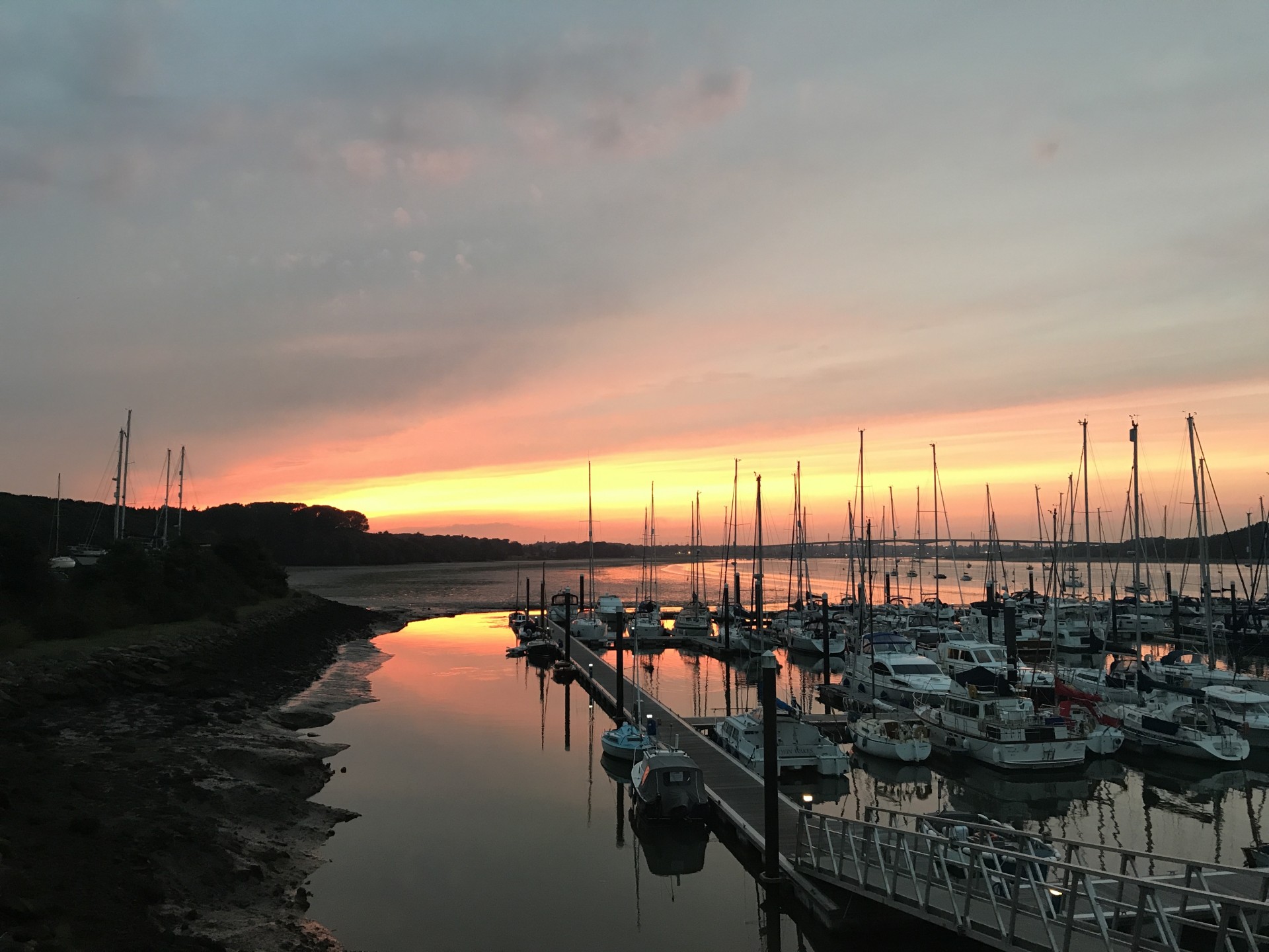 Guided night kayaking trips with a sunset in the distance