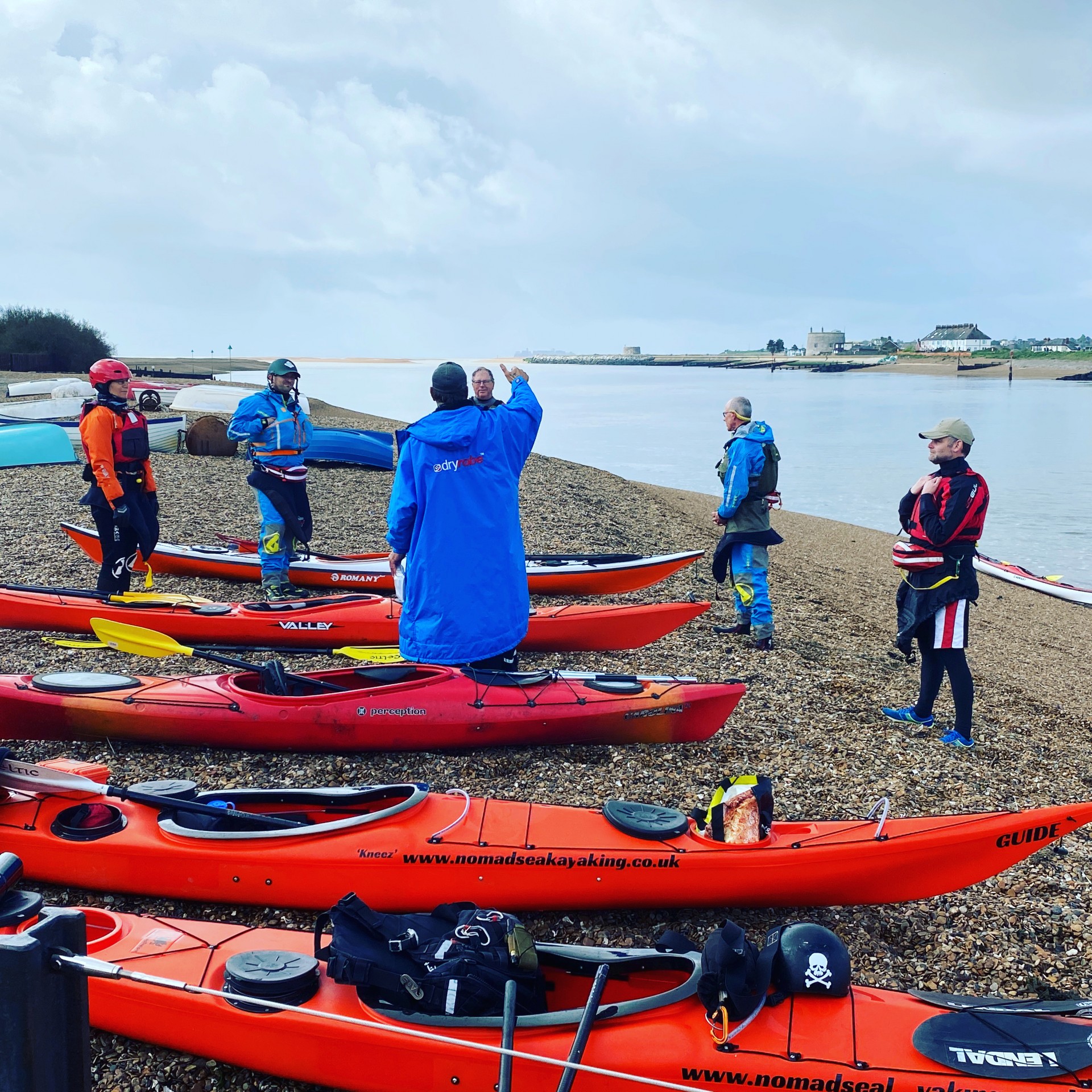 A coach briefing students before the Intermediate Sea Kayaking.