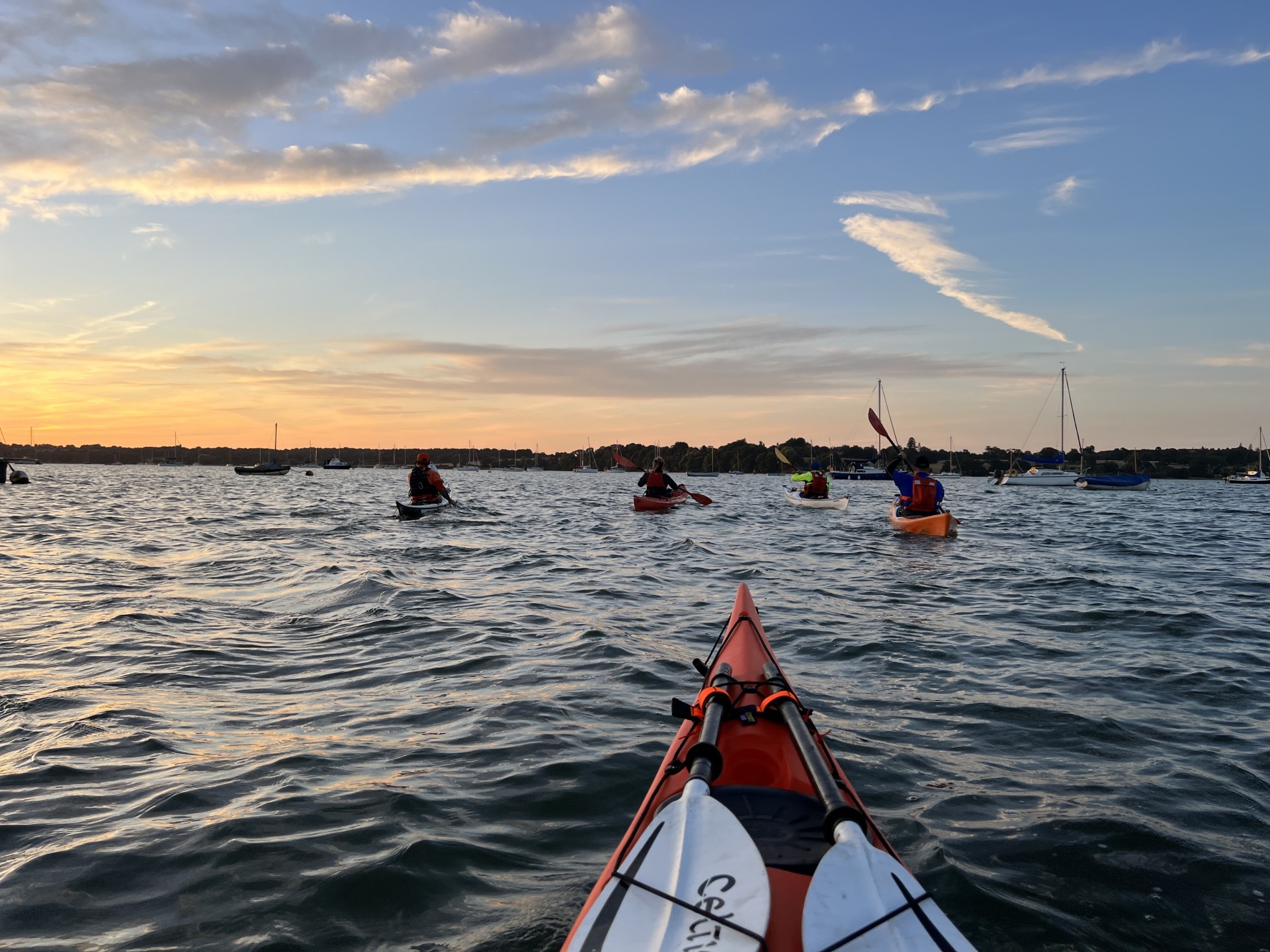 Sea kayakers following the flood tide on the Orwell estuary.