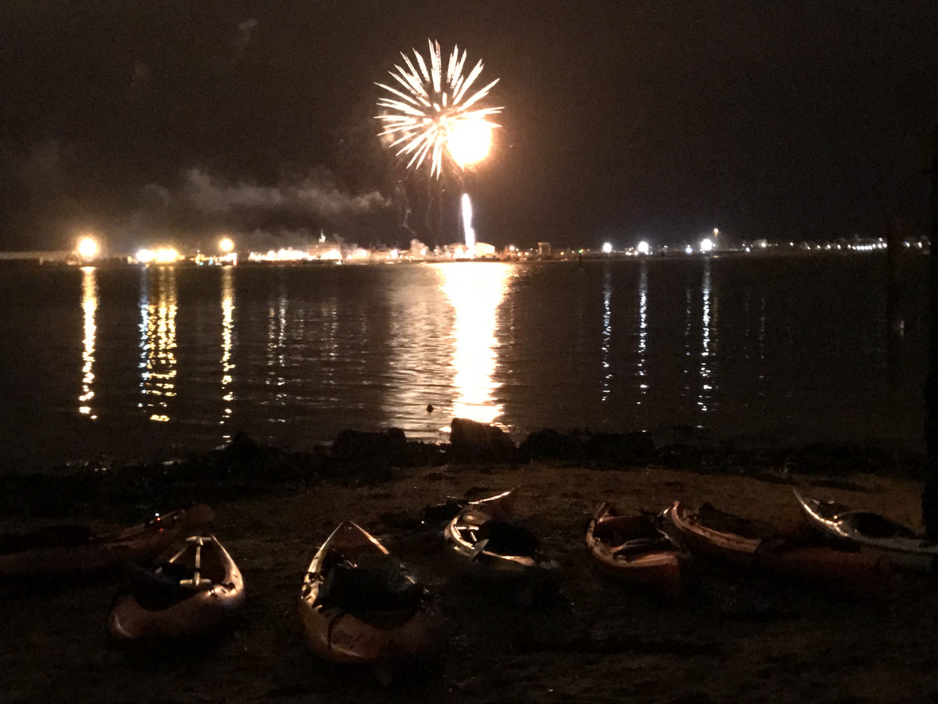 Fireworks exploding at night over Harwich on new years eve fireworks & kayaking trip with NOMAD Sea Kayaking.