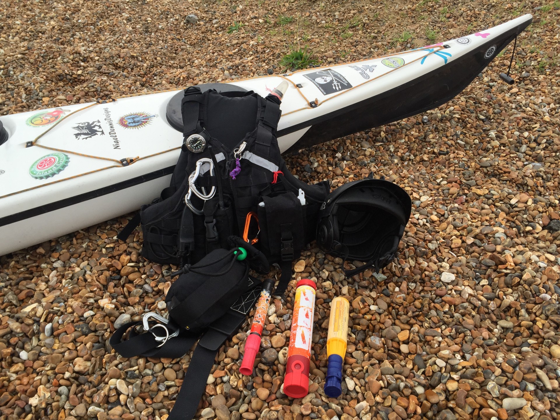 Typical safety equipment carried by sea kayakers.