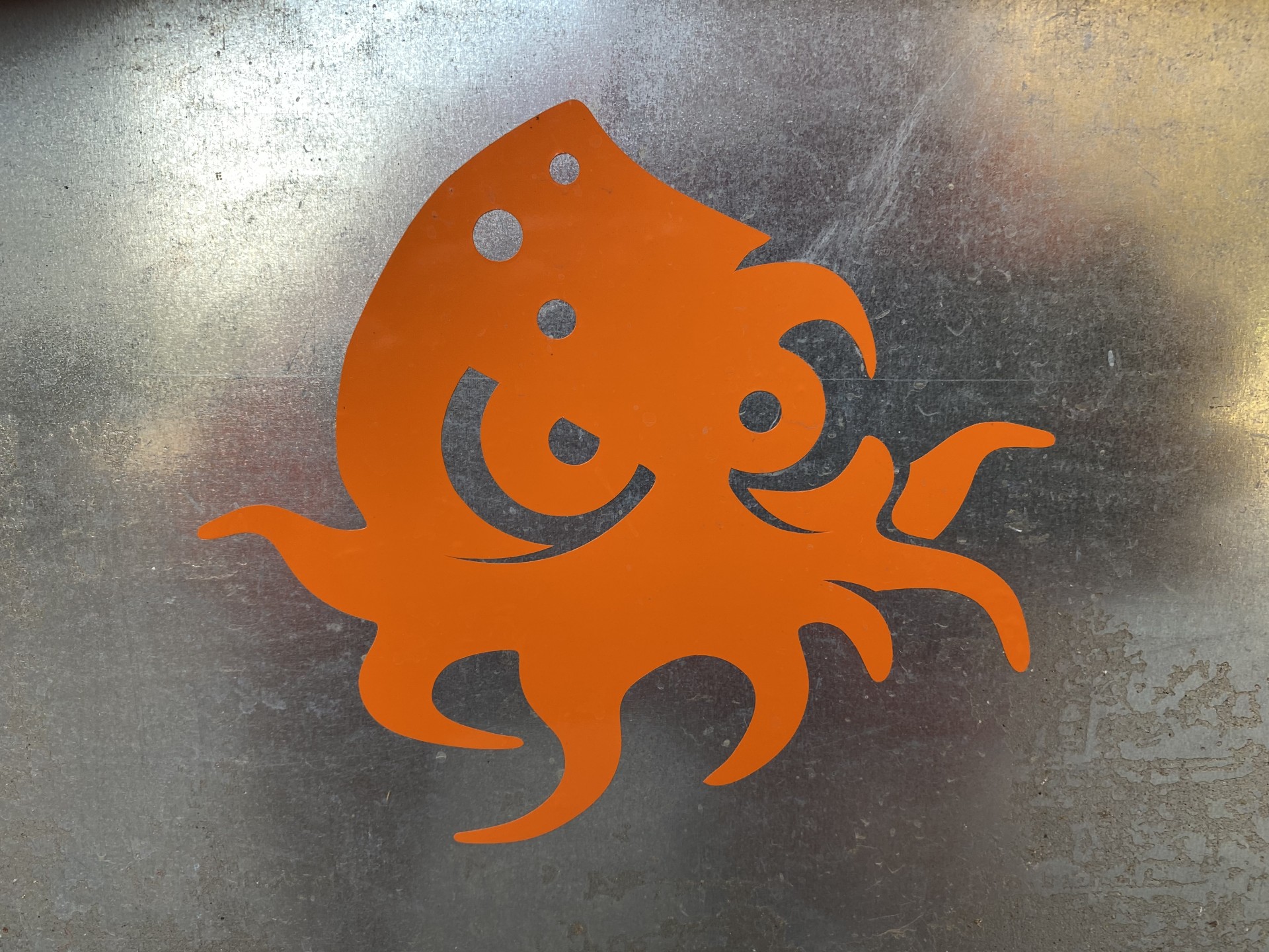 Baby kraken in orange bumper sticker.