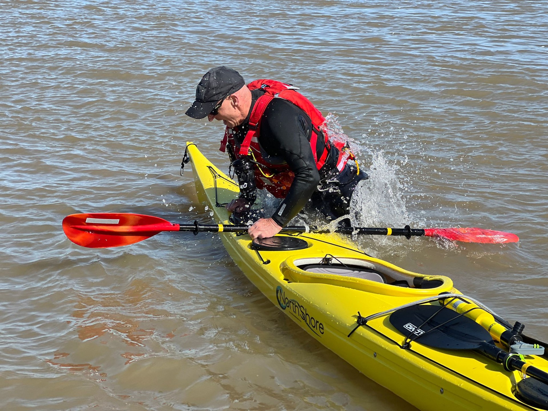 Sea kayaker practising self rescues with NOMAD Sea Kayaking.