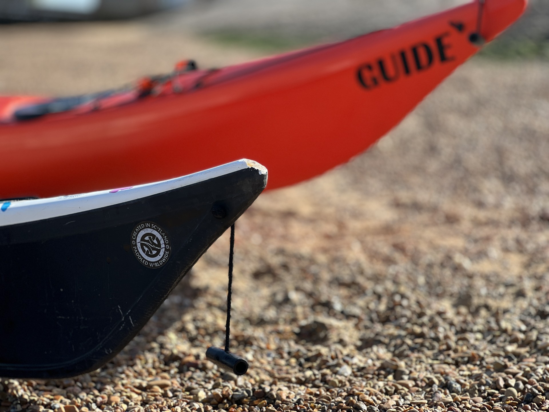 Orange sea kayaks used by guides with NOMAD Sea Kayaking.