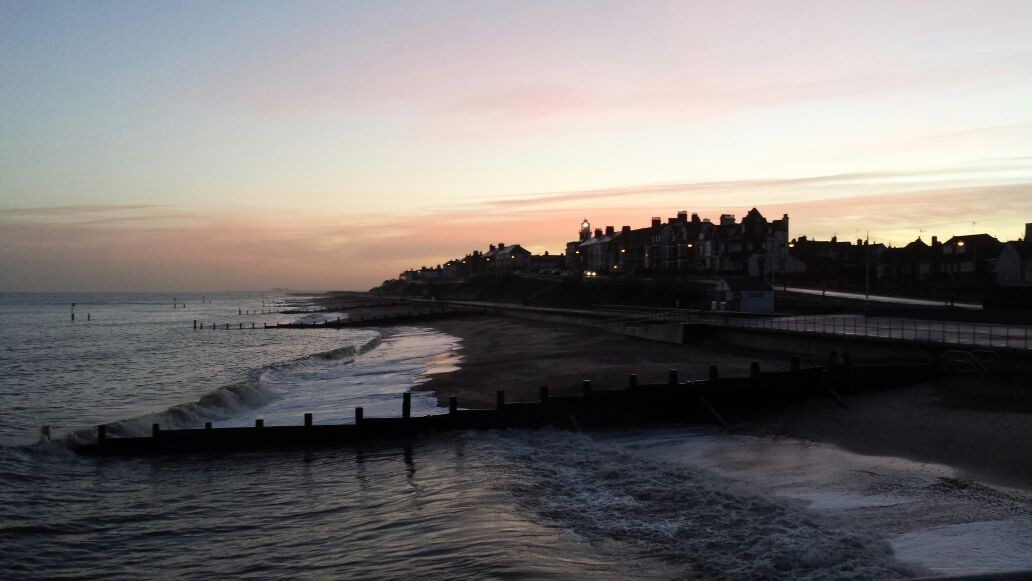Harwich beach shoreline at sunset.