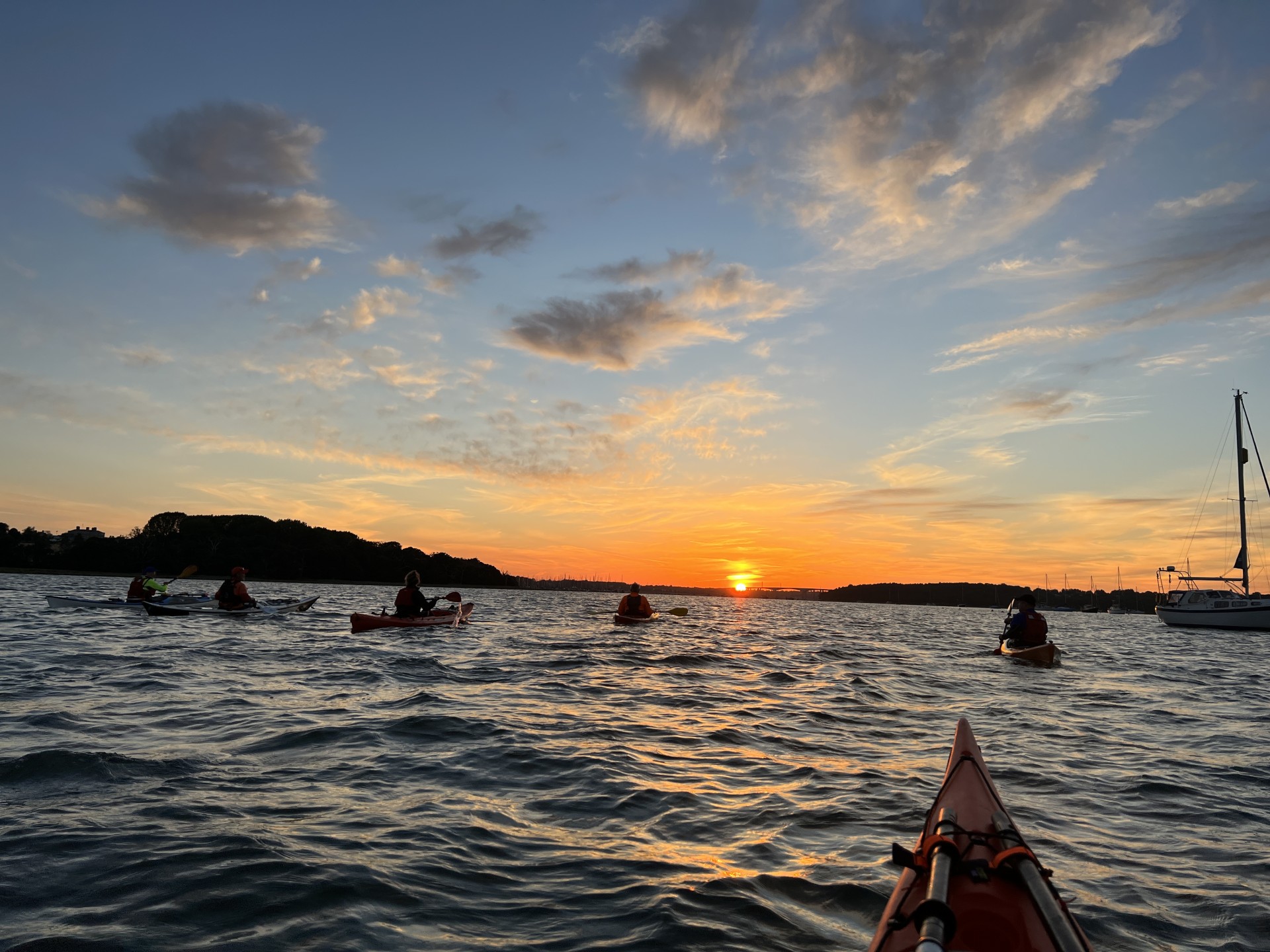 Sea kayakers watching the sun go down.