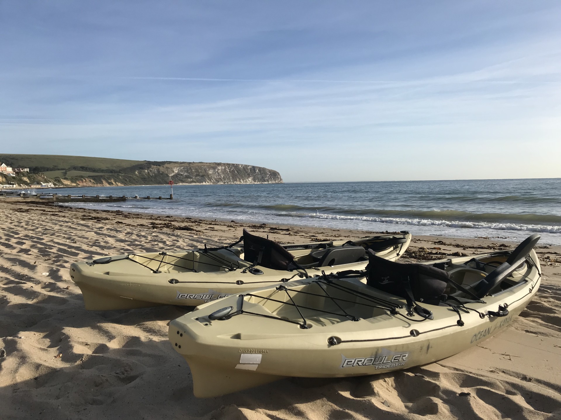 kayaks on a beach in Swanage Dorset.