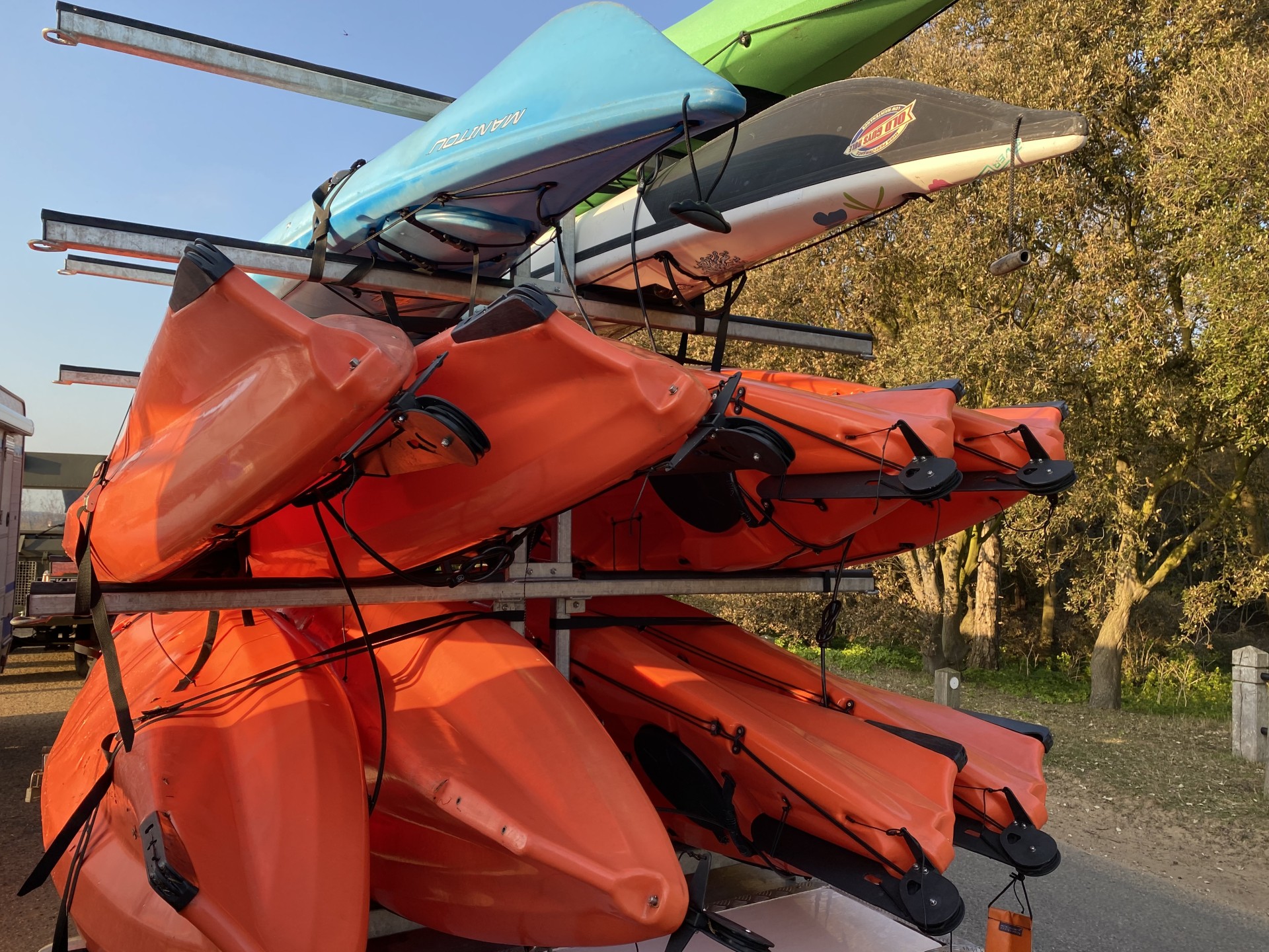 Kayaks loaded on to a large trailer.