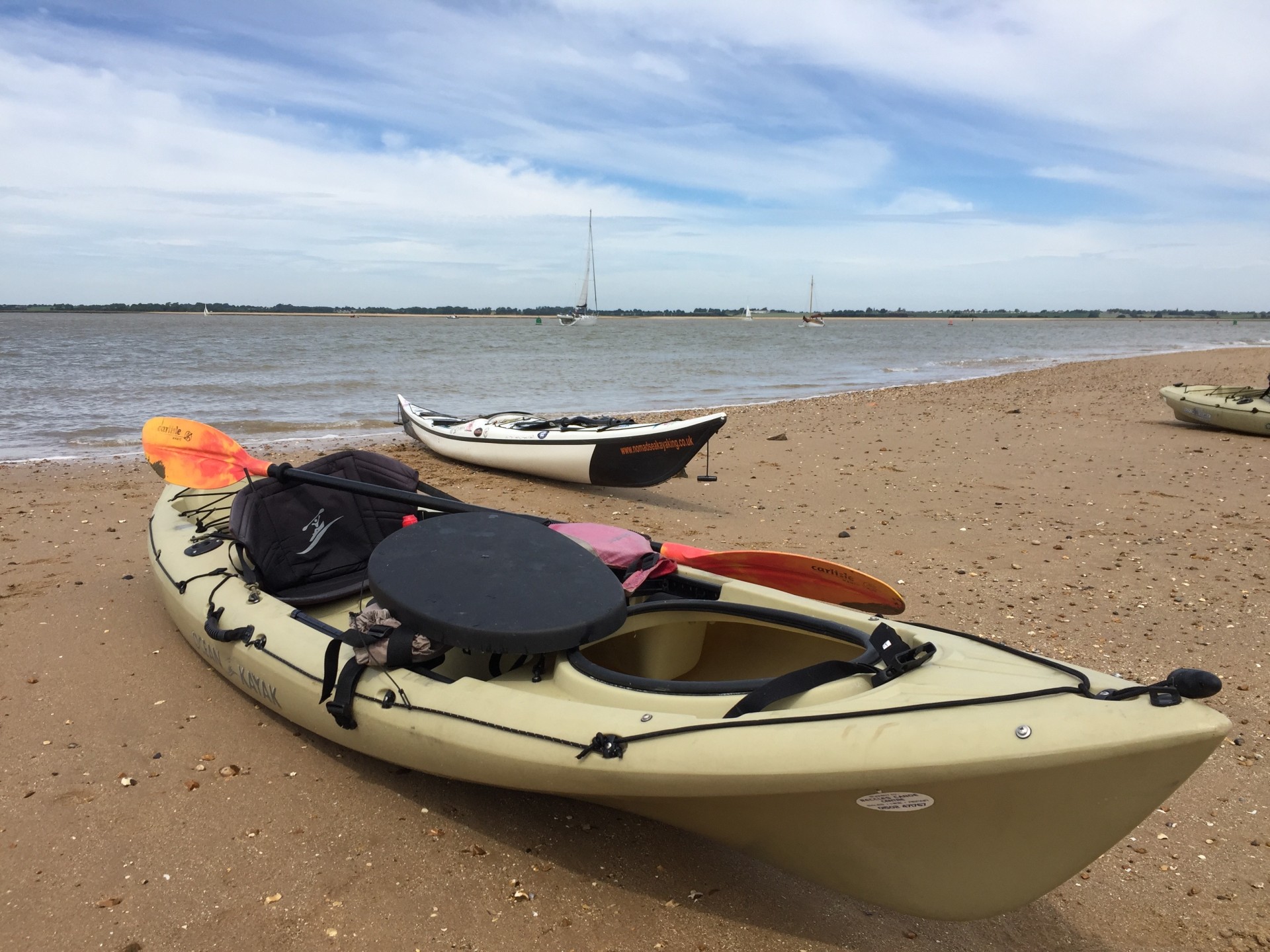 Kayak on Stone Point beach with NOMAD Sea Kayaking.
