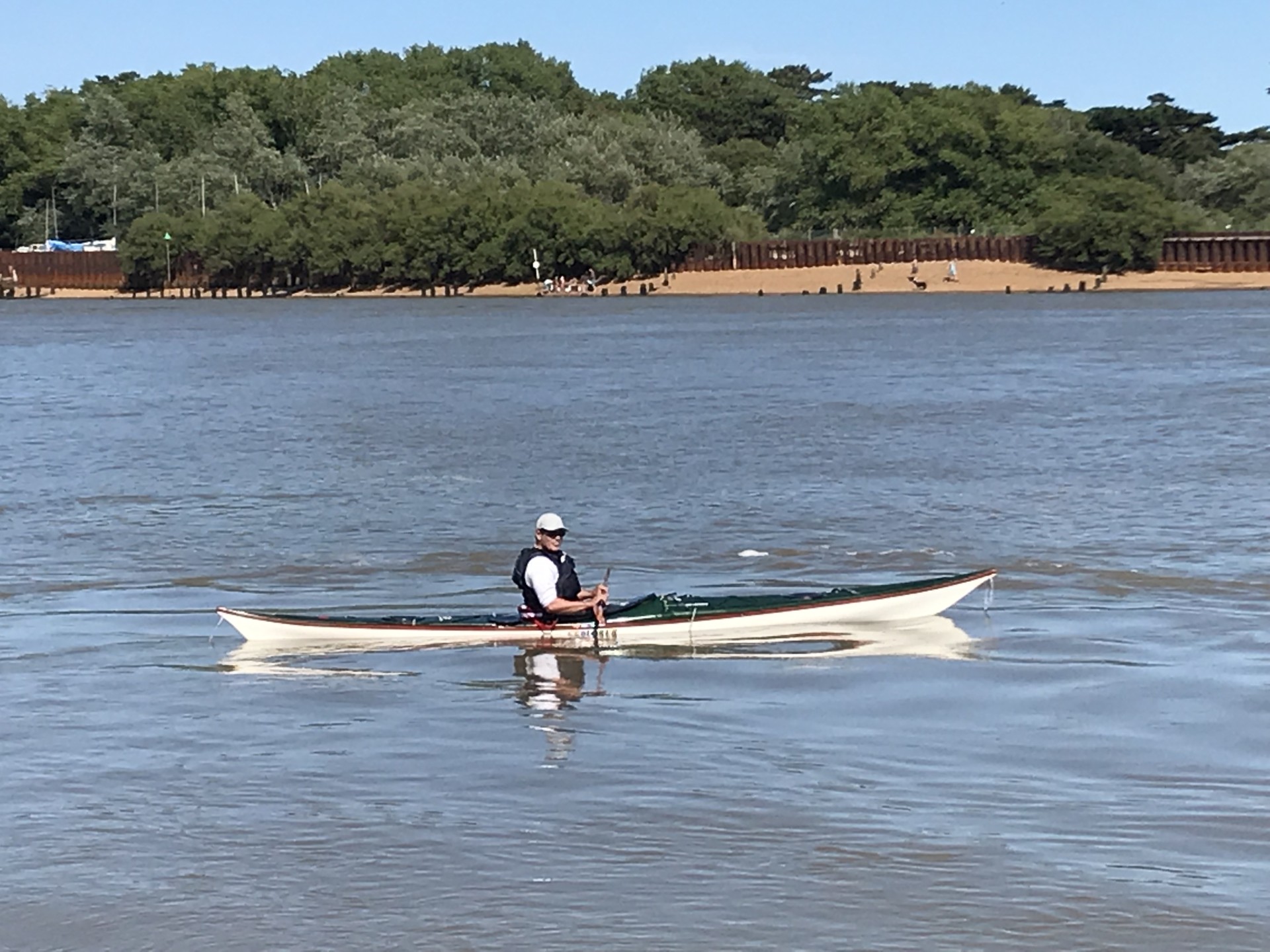 A sea kayaker near the mouth of the Deben estuary with NOMAD Sea Kayaking.