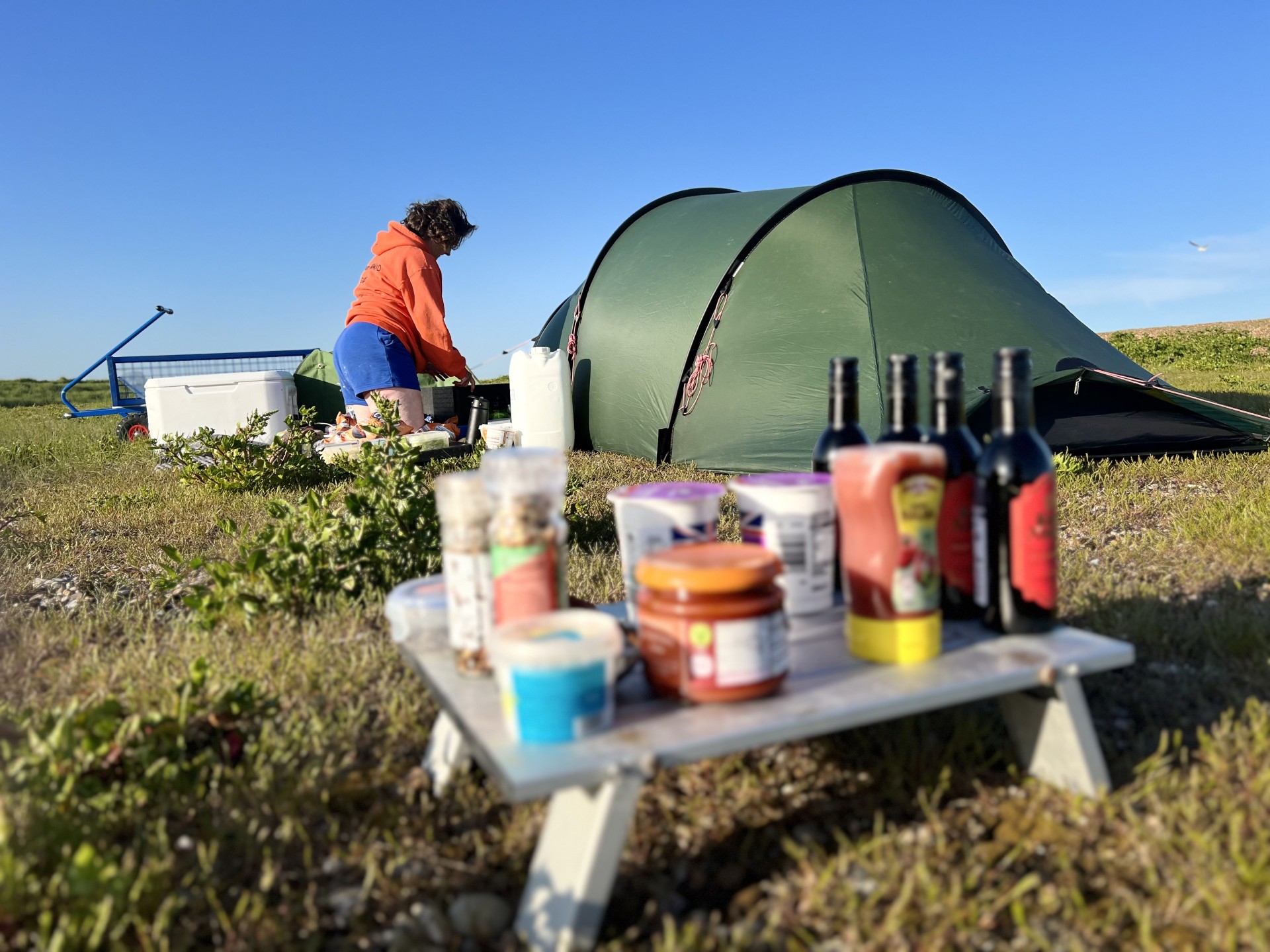 Guide wild camp with food and condiments at the ready.