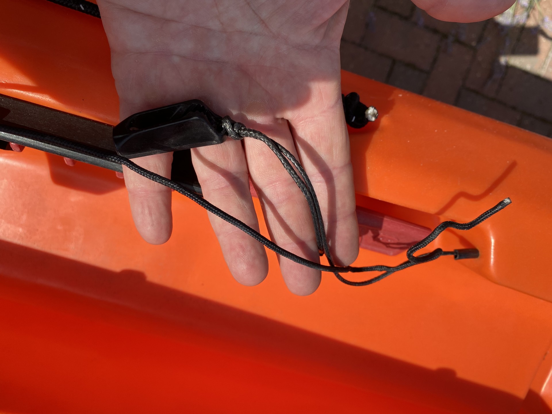Sit-on-top kayak rudder foot adjustment cable.