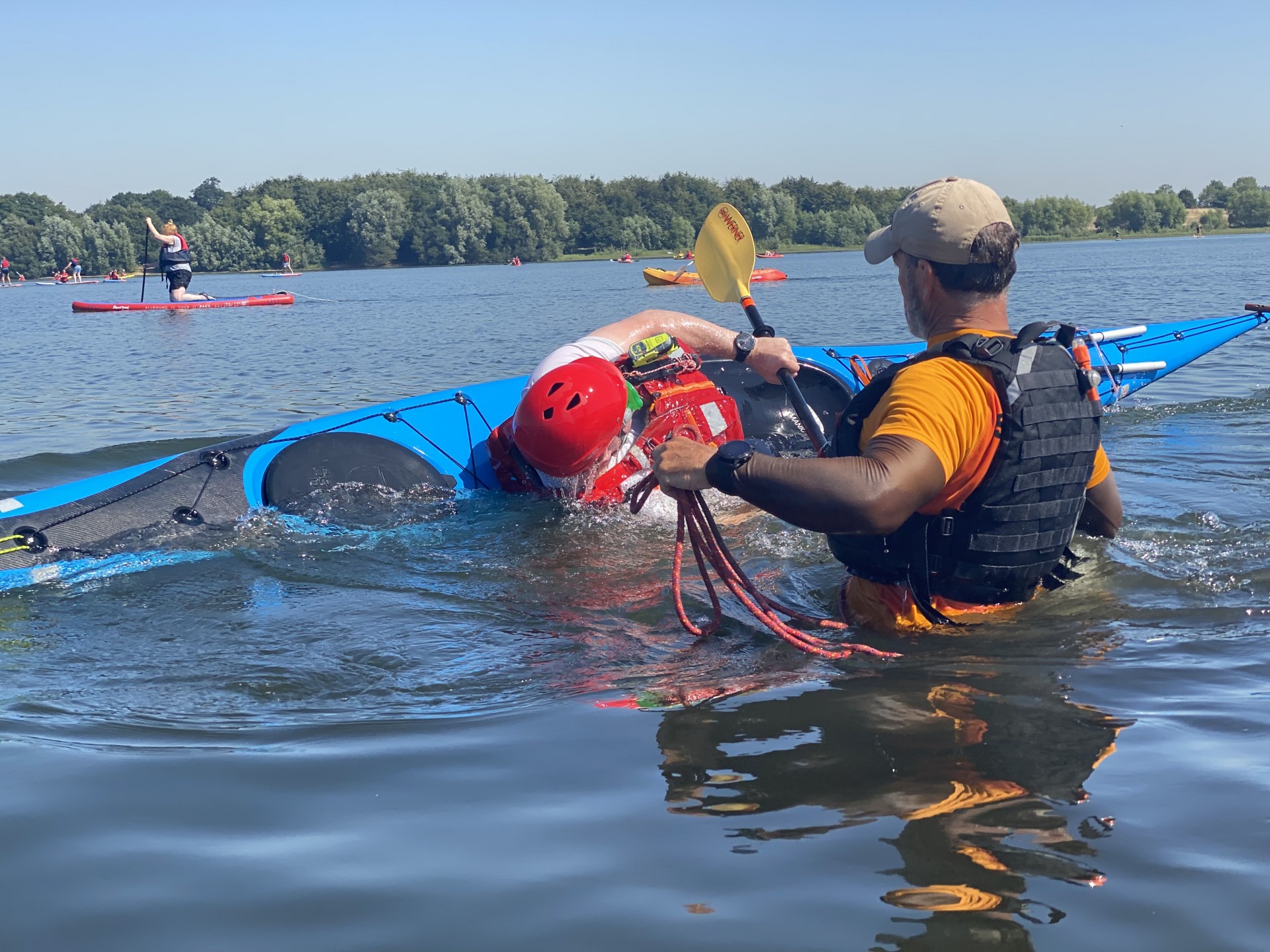 Paddler learning to Eskimo roll their sea kayak effectively.