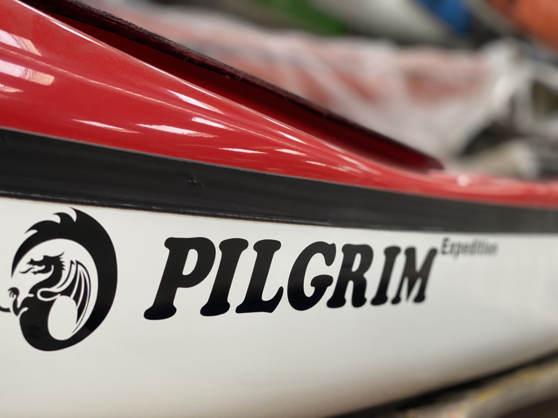 Pilgrim expedition composite red deck with white hull sea kayak