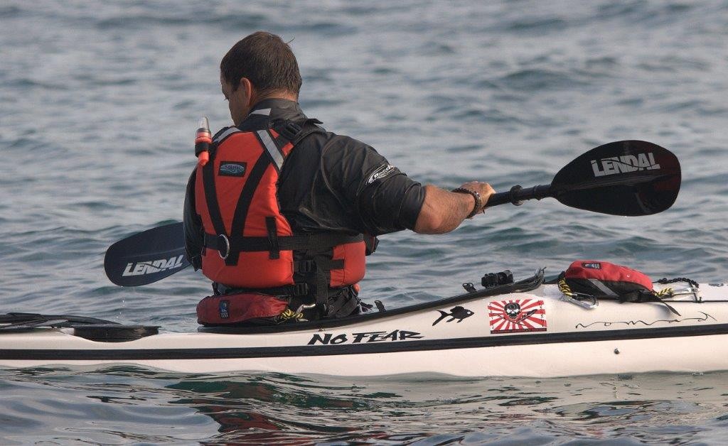 No Fear sea kayaker on the Dorset Jurassic coast with N.S.K.