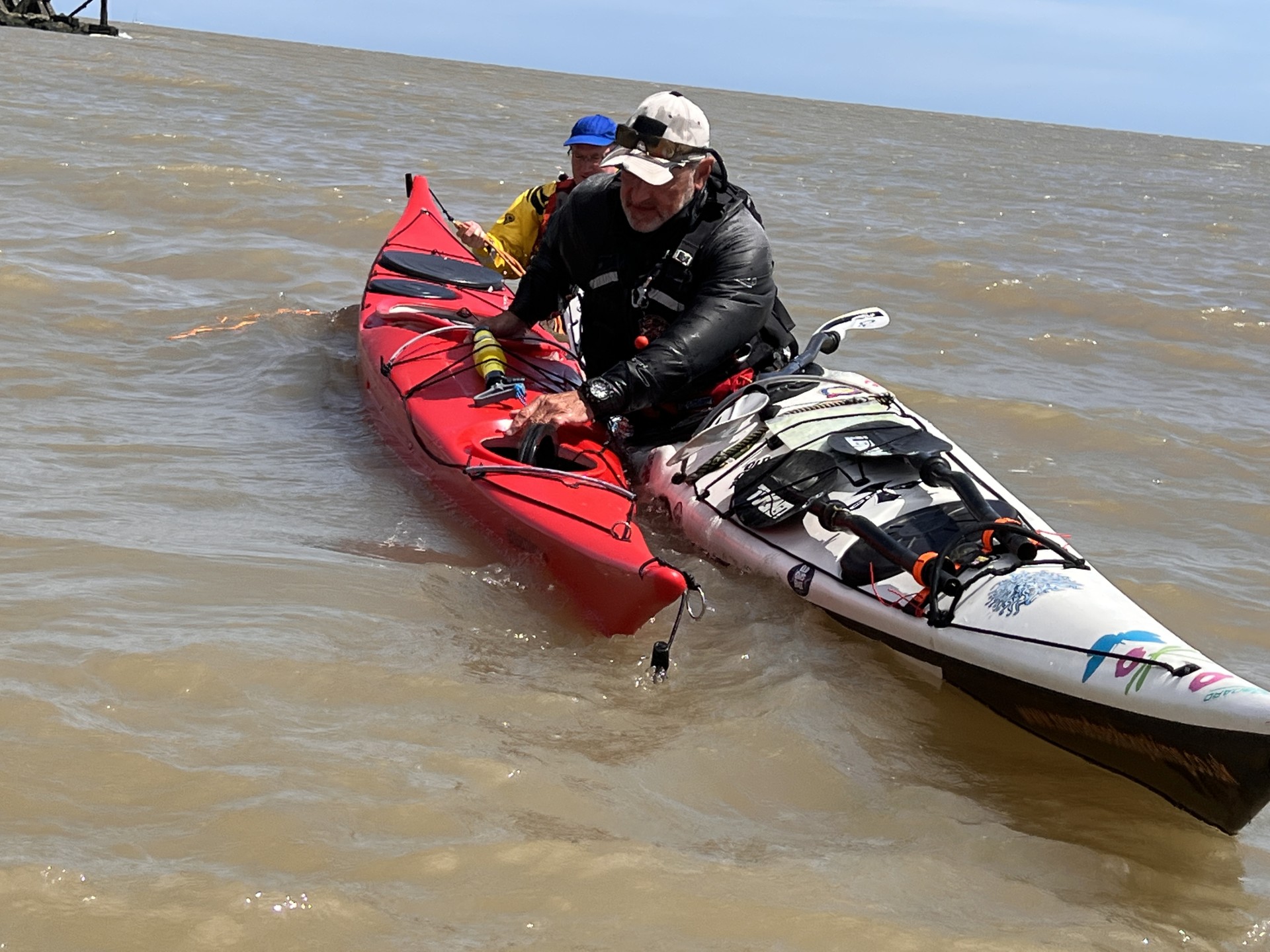 Flooding a sea kayak hatch to recover with NOMAD Sea Kayaking.