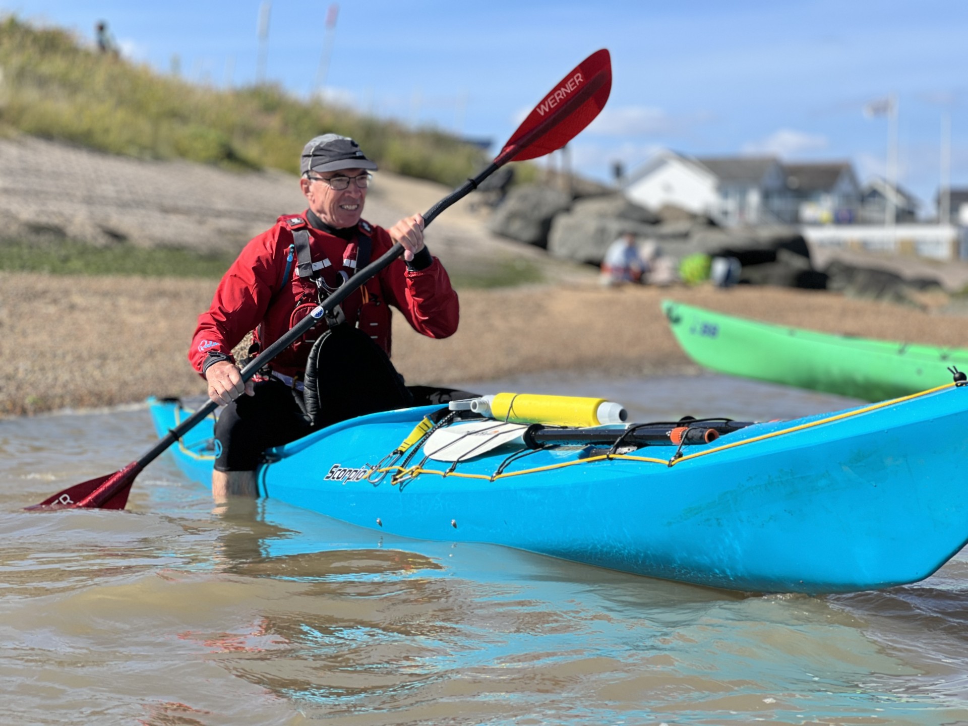 balancing on the back deck of a P&H Scorpio sea kayak with NOMAD Sea Kayaking.
