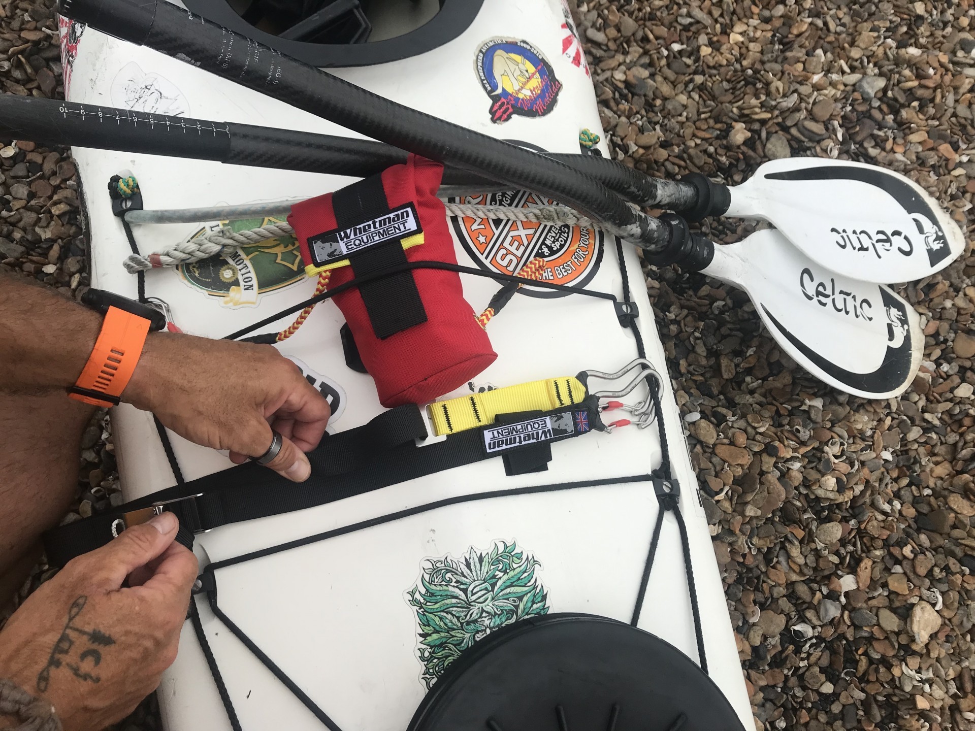 Whetman Limpet throw bag attached to the deck of a sea kayak