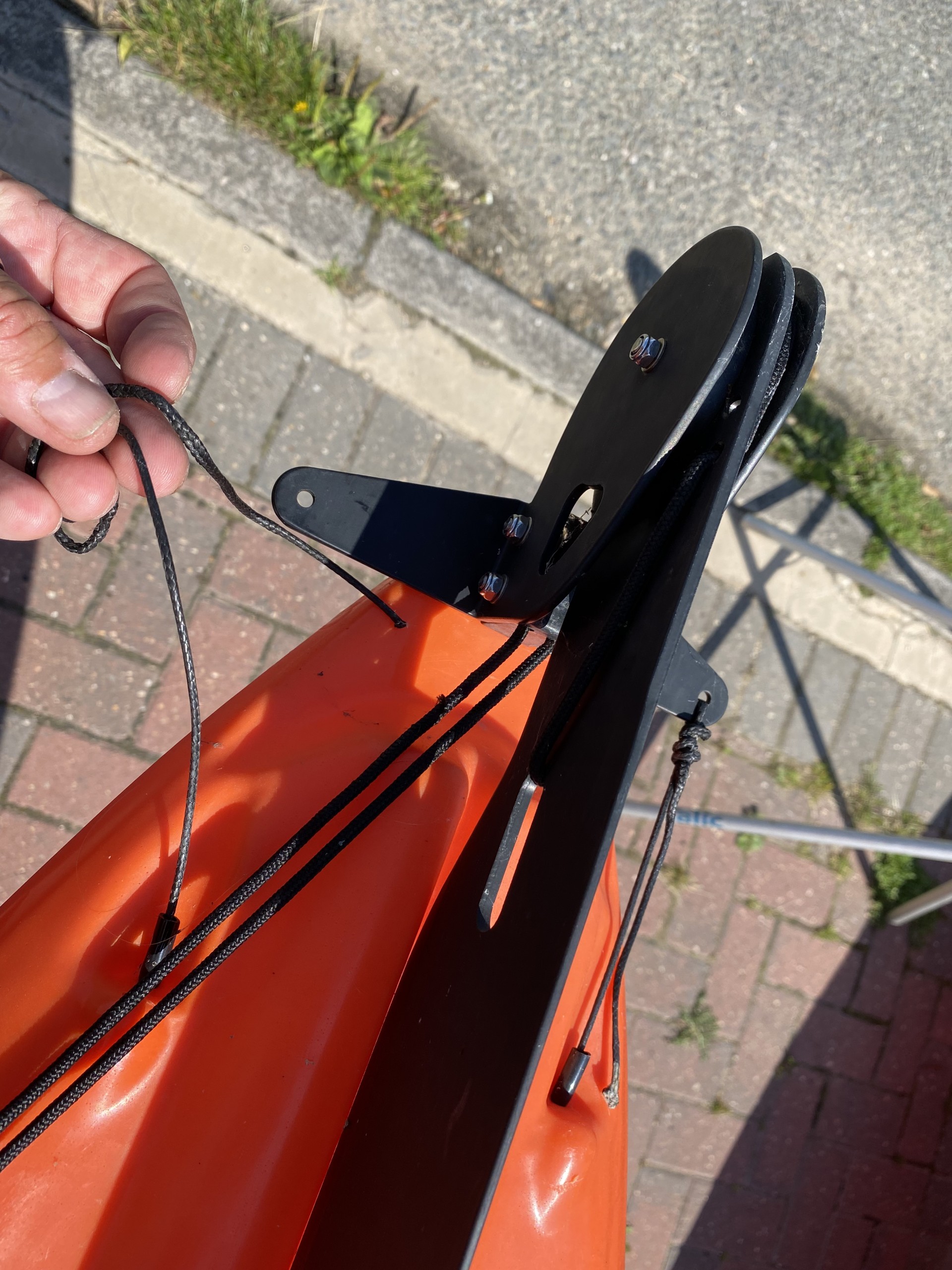 Sit-on-top kayak rudder top view showing where steering cable joins.