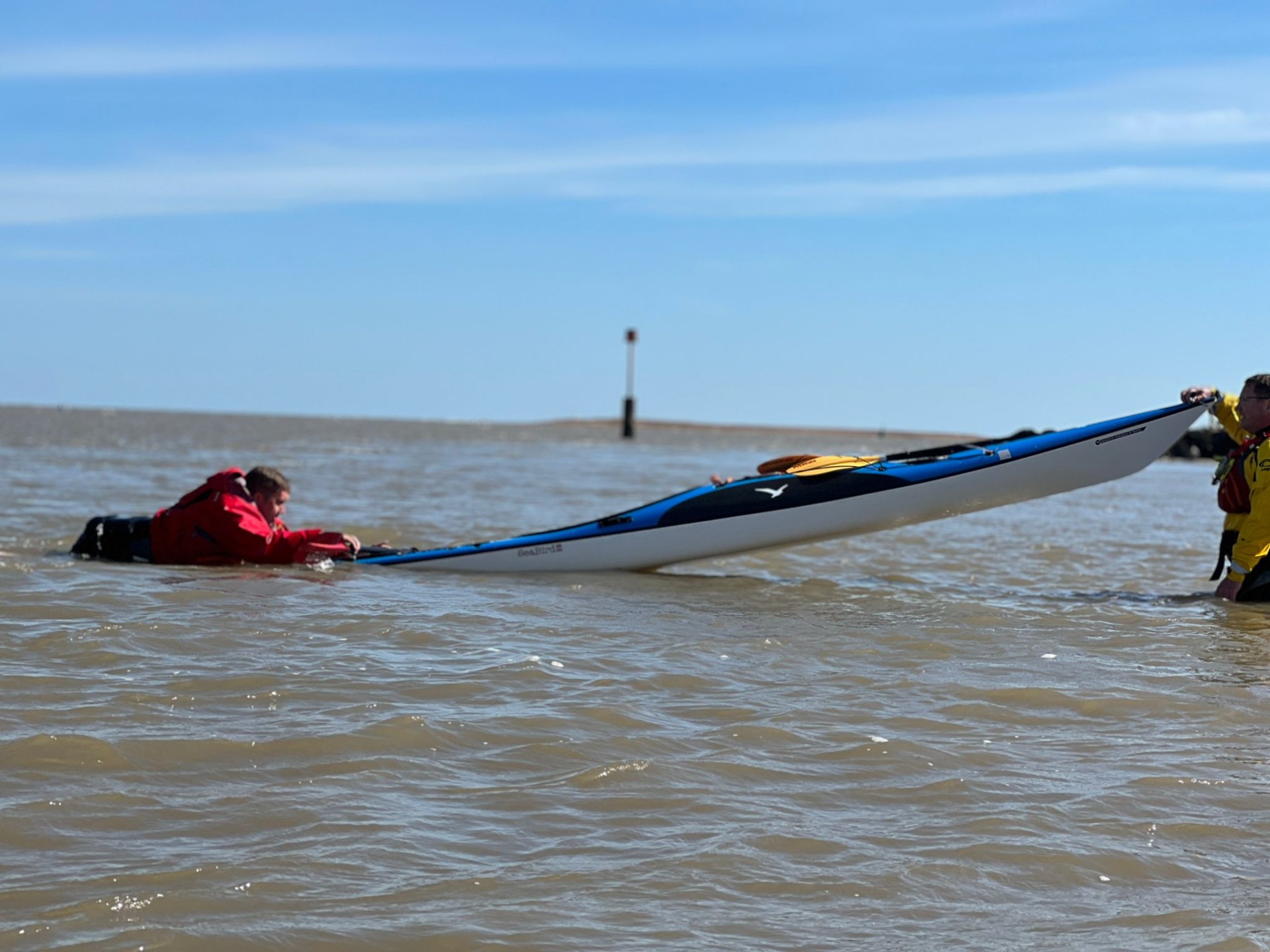 Practising self rescues in a sea kayak with NOMAD Sea Kayaking.