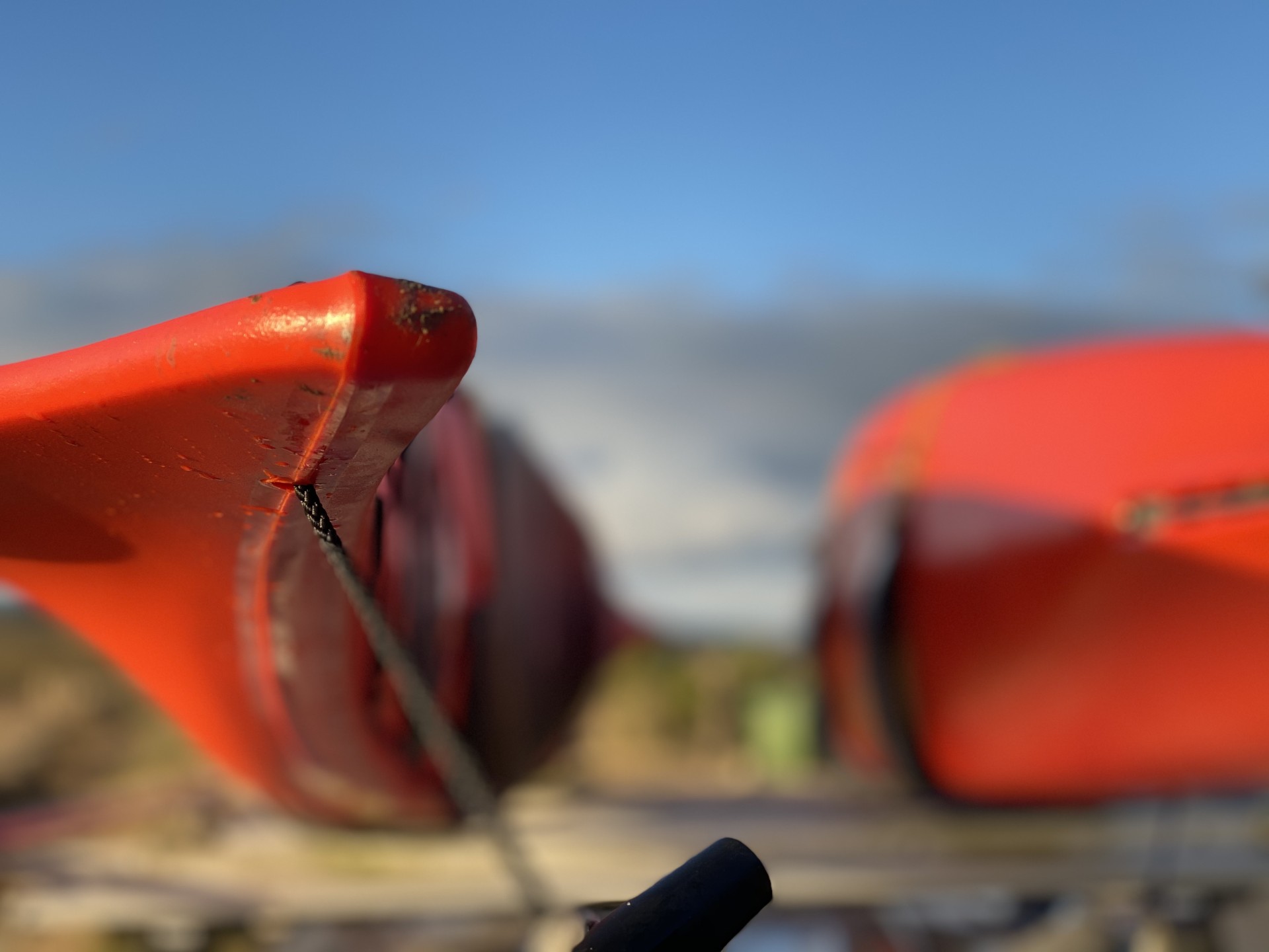 Orange sea kayaks with NOMAD Sea Kayaks.