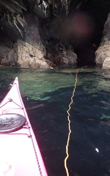 Throw bag in use in a sea cave