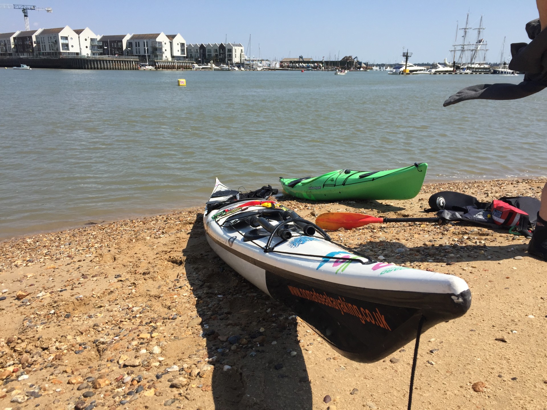 Kayaks on a beach in Brightlingsea Essex.