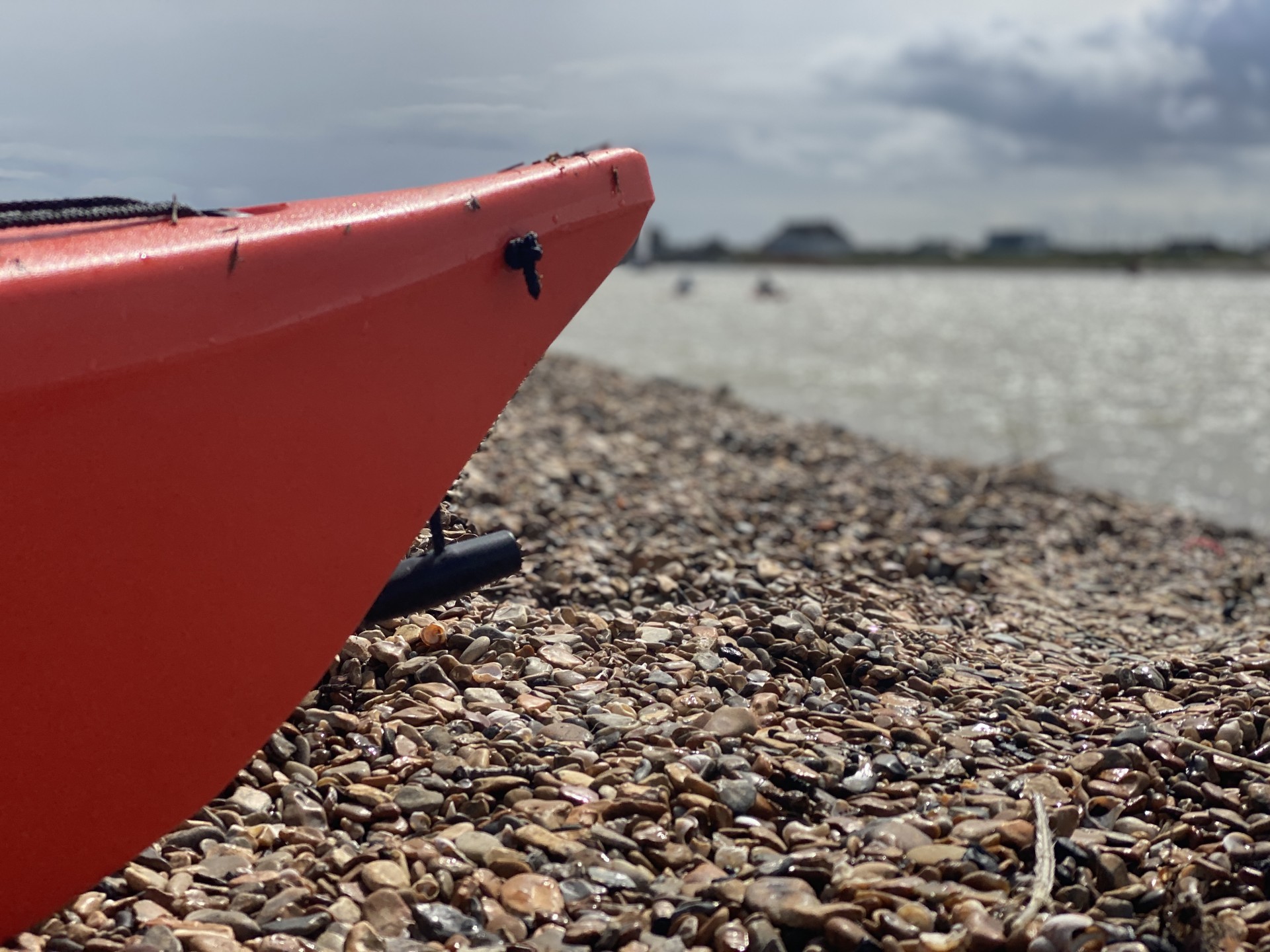 Sea kayaks on the beach near the Deben estuary.