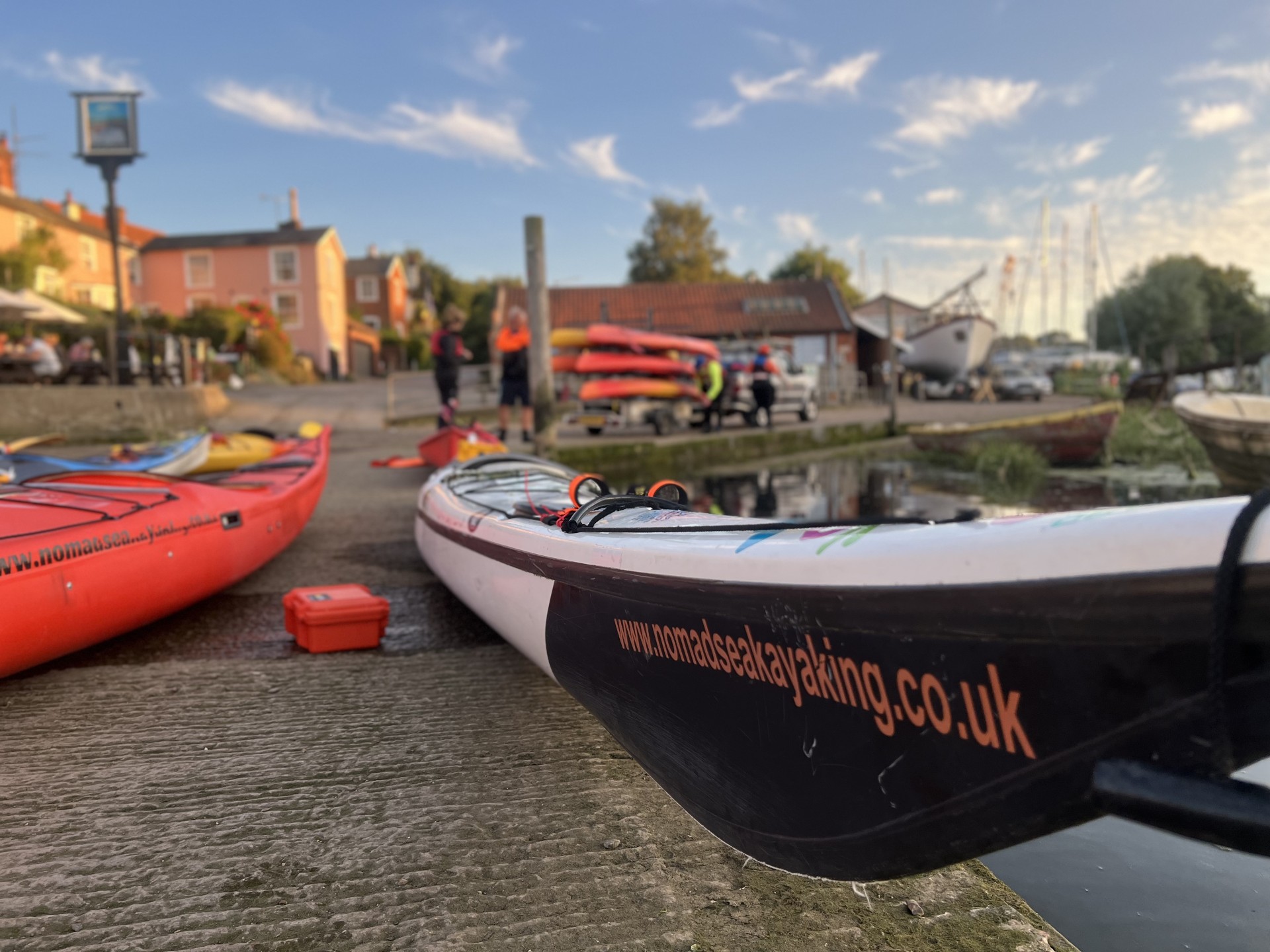 Kayaks on a slipway ready to launch.