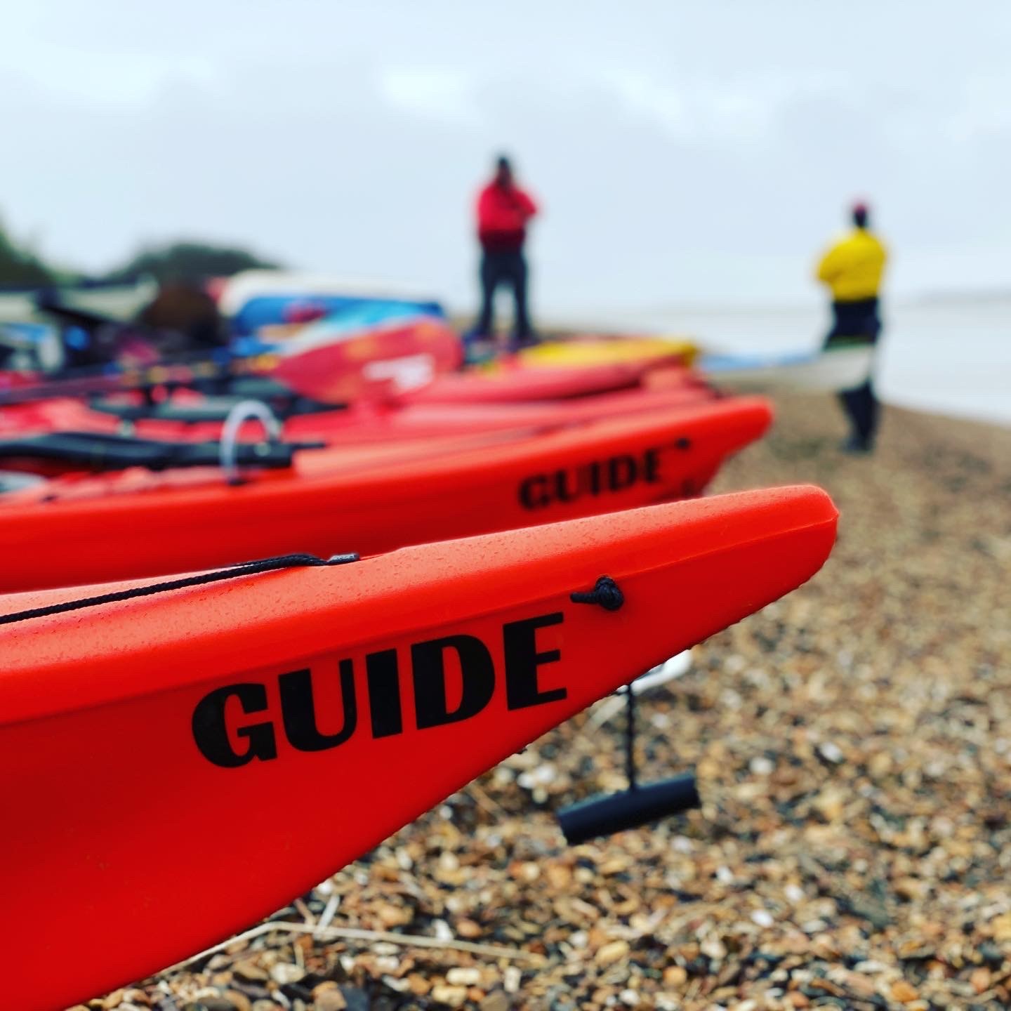 Guide sea kayaks ready for launch with NOMAD Sea Kayaking.