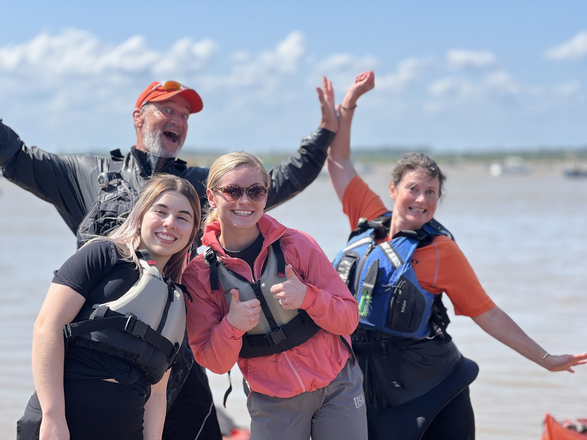 Exuberant guides with NOMAD Sea Kayaking.
