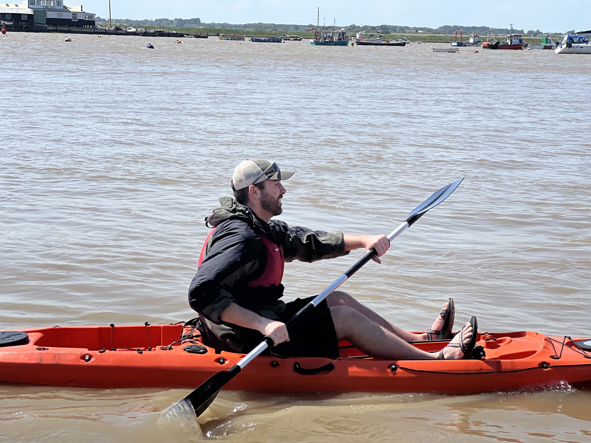 Same sea kayaker paddling his kayak on the Deben estuary.