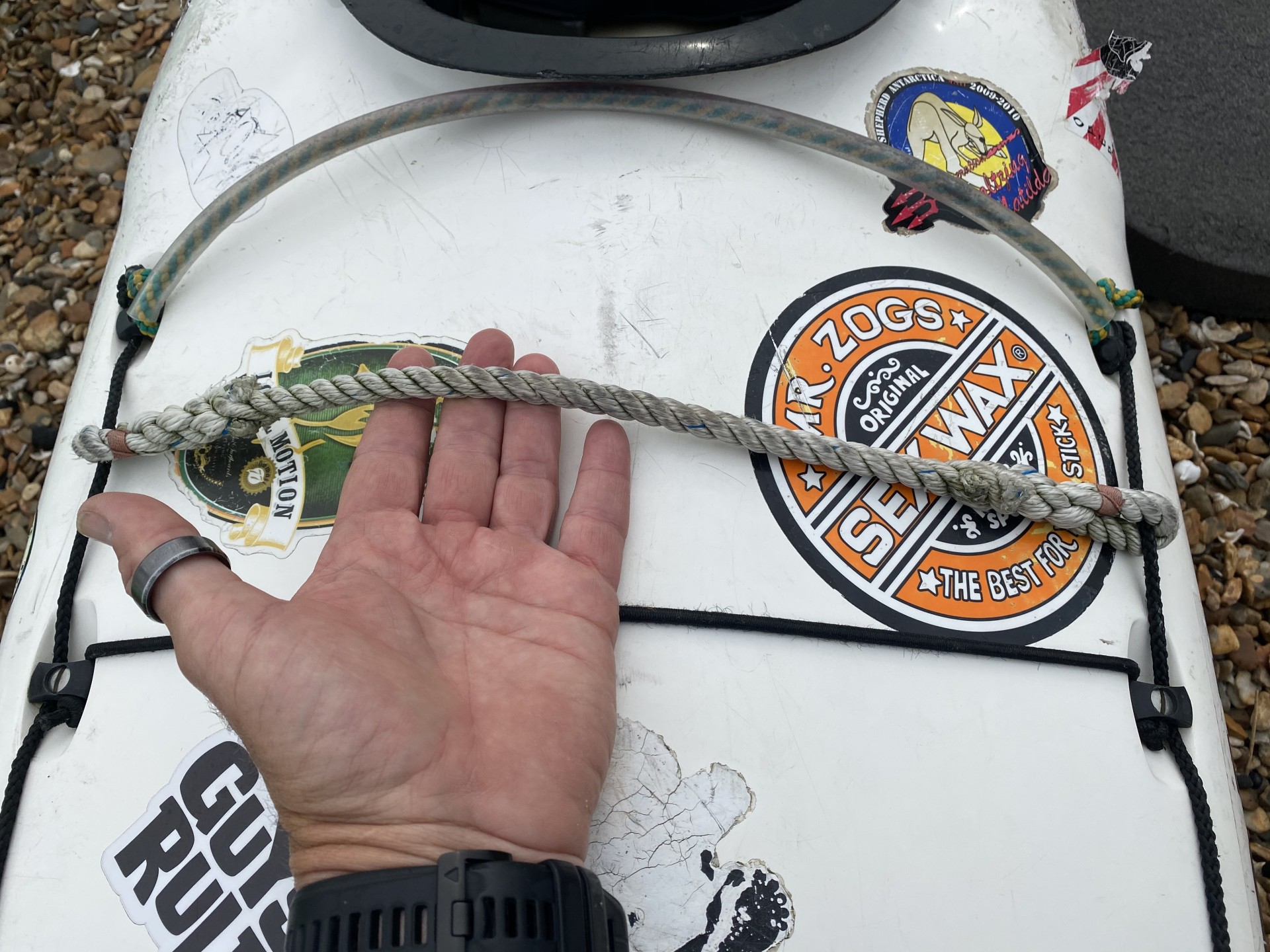 Rope sling across the deck of a sea kayak with NOMAD Sea Kayaking.