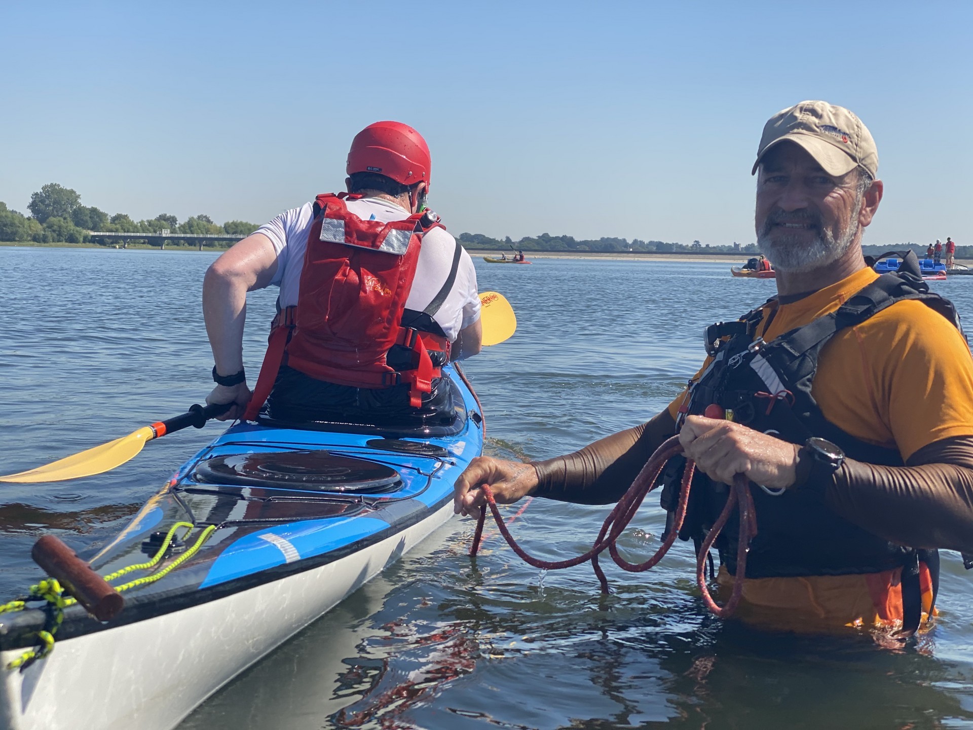 Teaching a sea kayaker to roll with NOMAD Sea Kayaking.