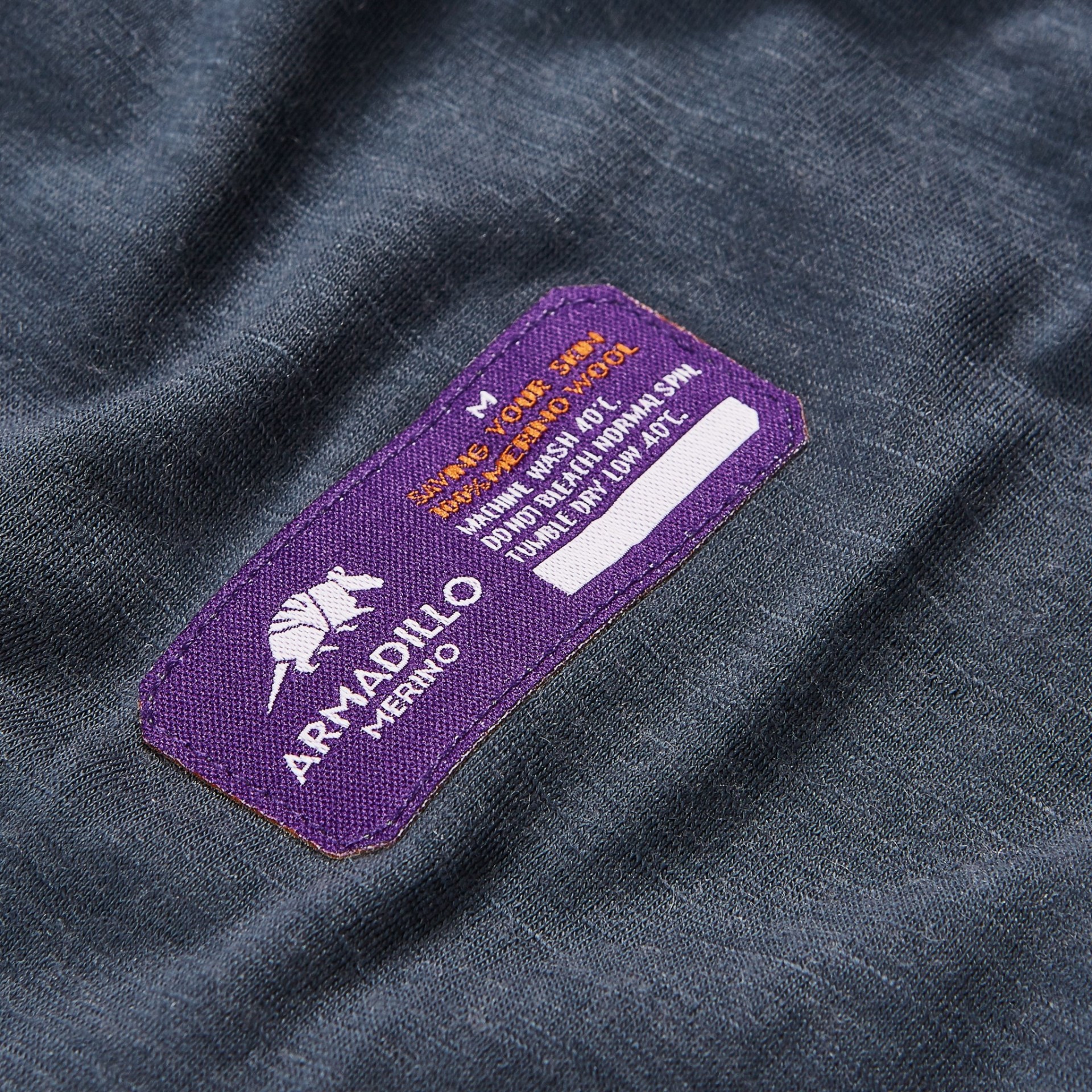 Labels on the outside of merino wool base layers