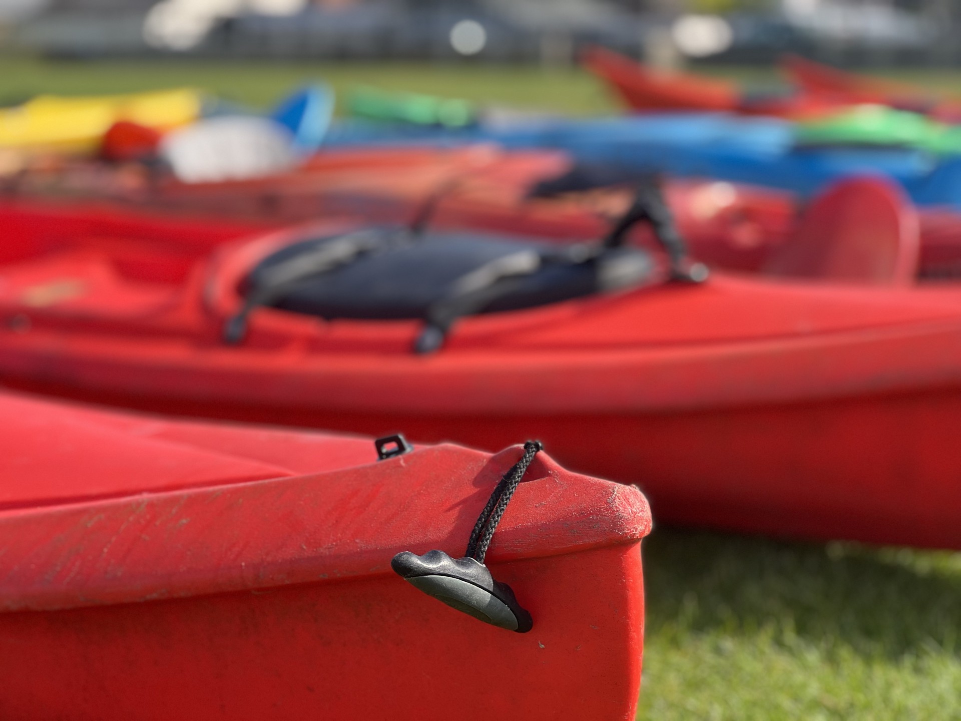 Red sit-on-top kayaks.
