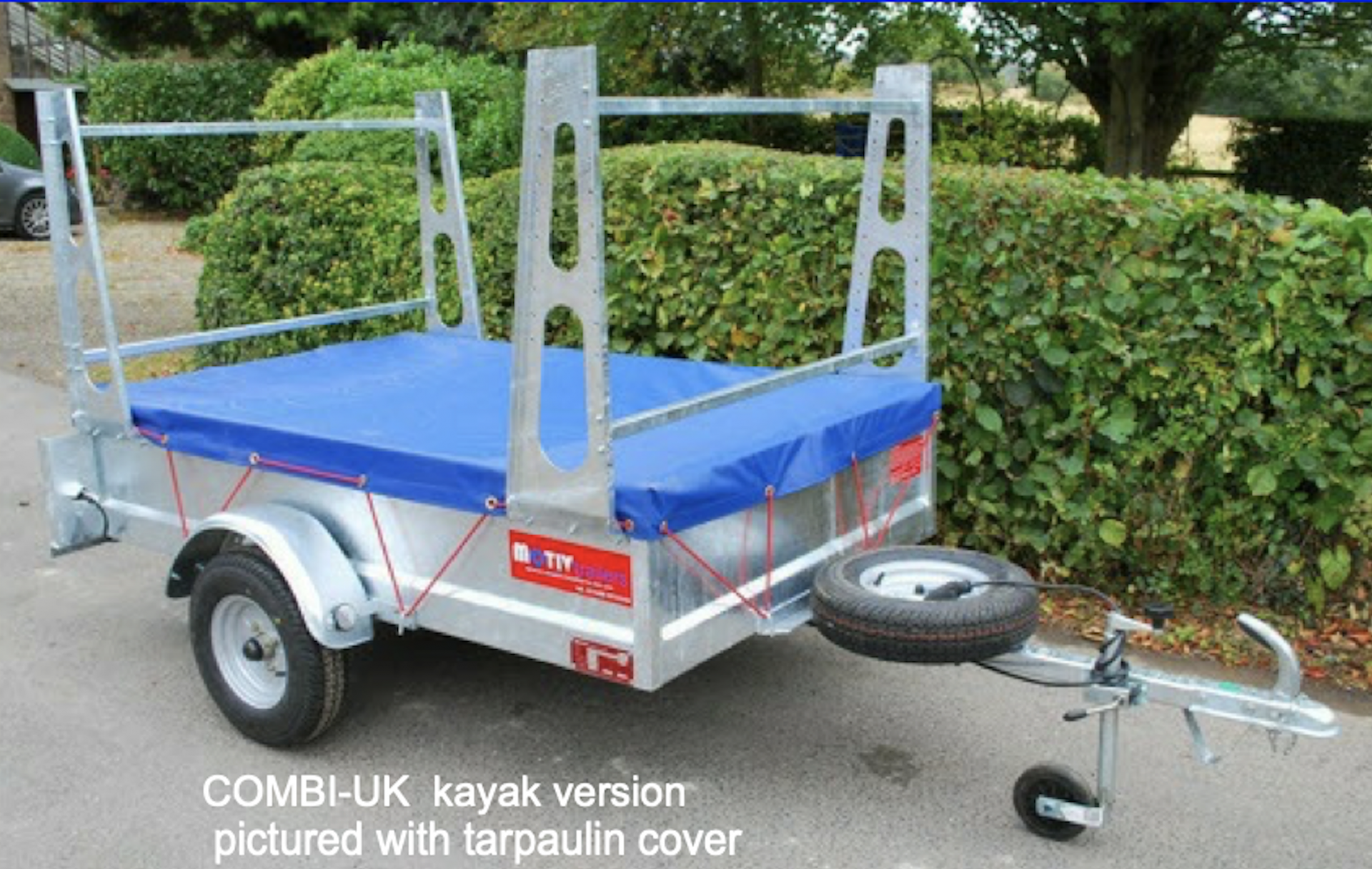 Motiv Combi Kayak Trailer with tarpaulin cover.