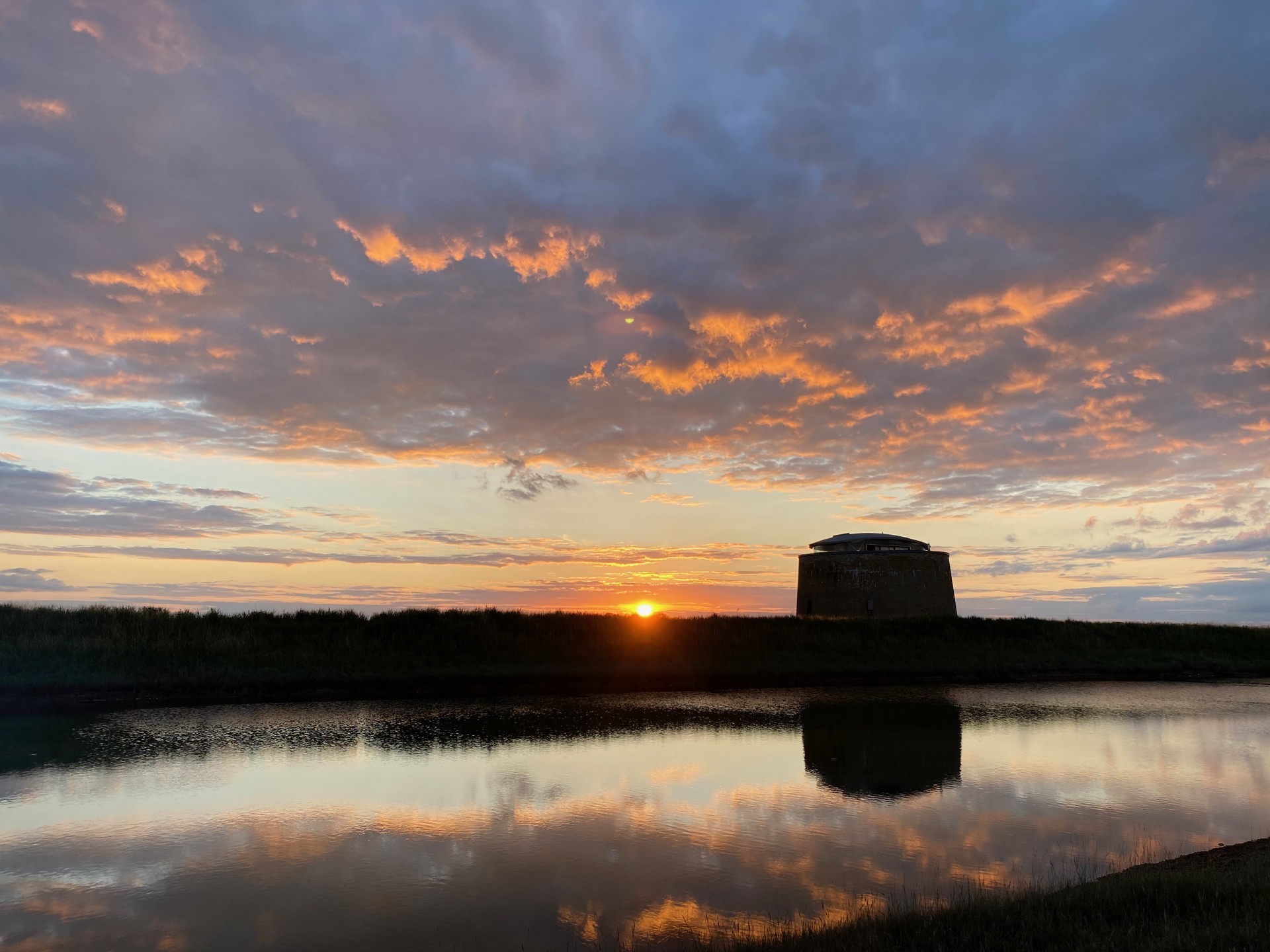 Sunset in Suffolk, sea kayaking and wild camping.