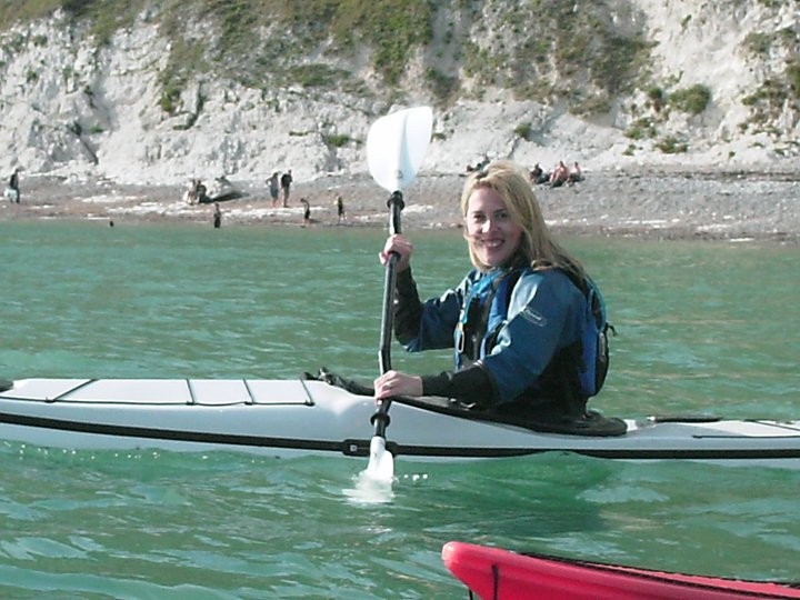 Lady in a sea kayak in Dorset.