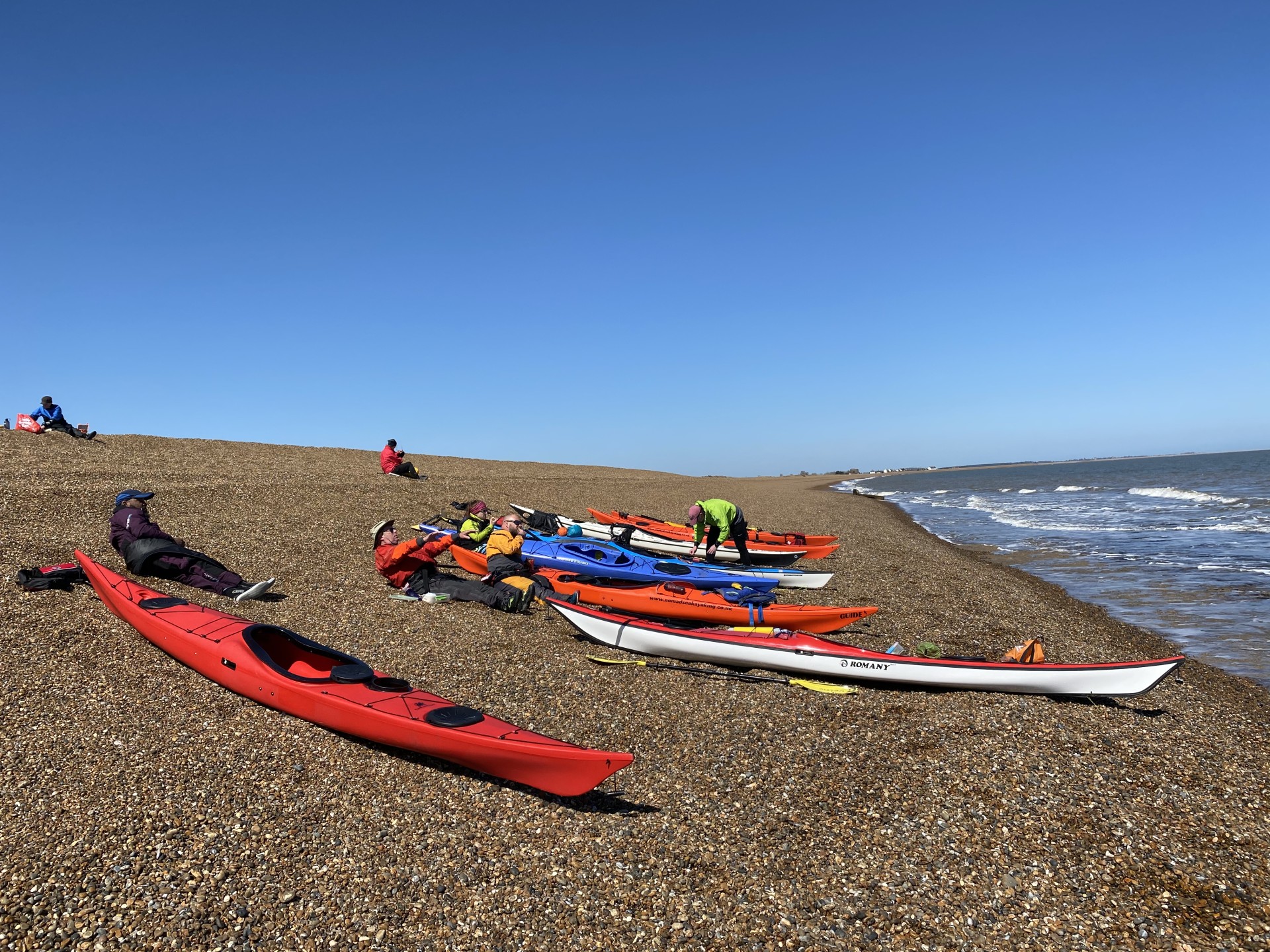 Sea kayaks on a remote Suffolk beach.