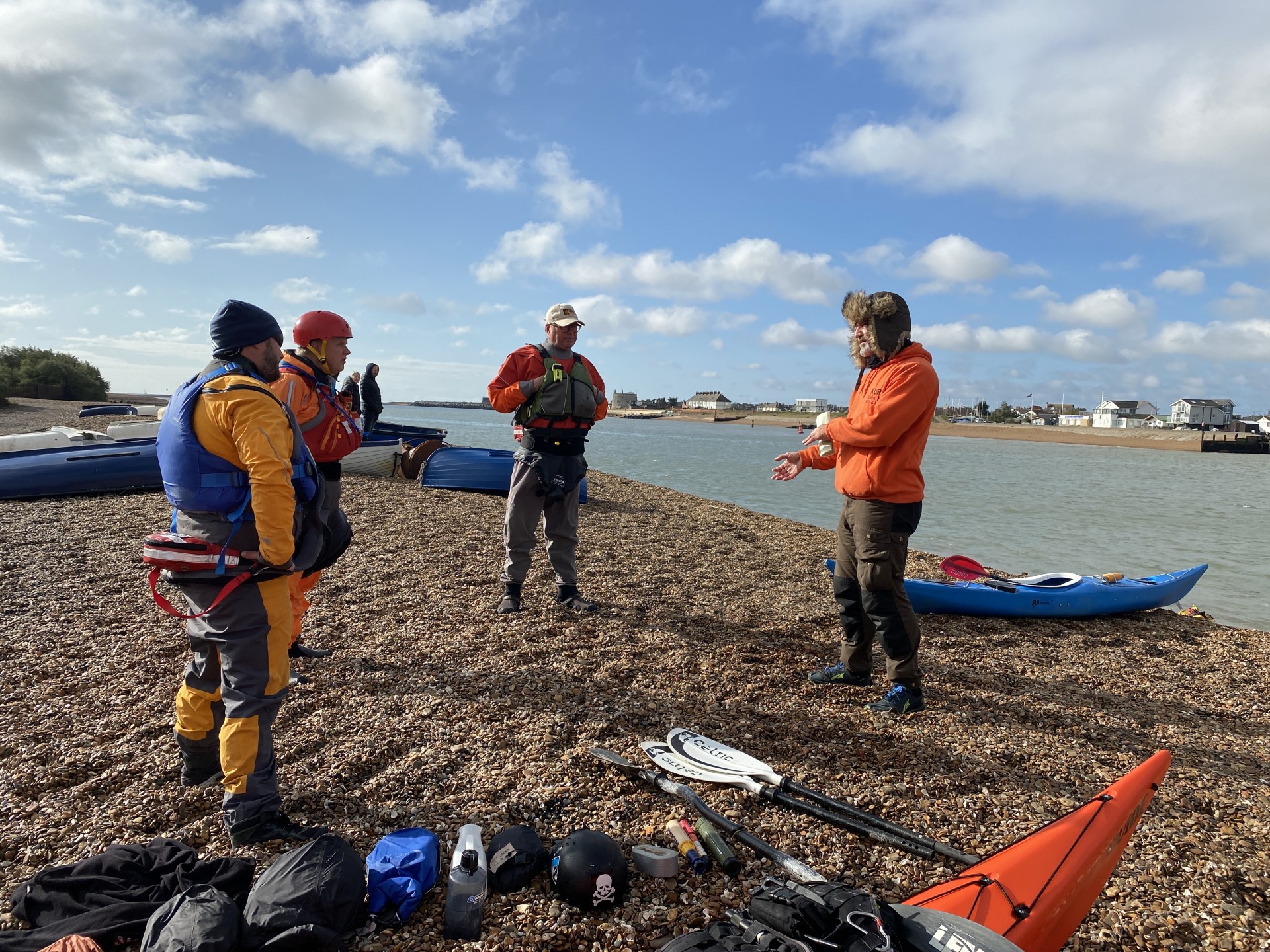 Sea kayakers doing their safety briefing prior to launching for the day.