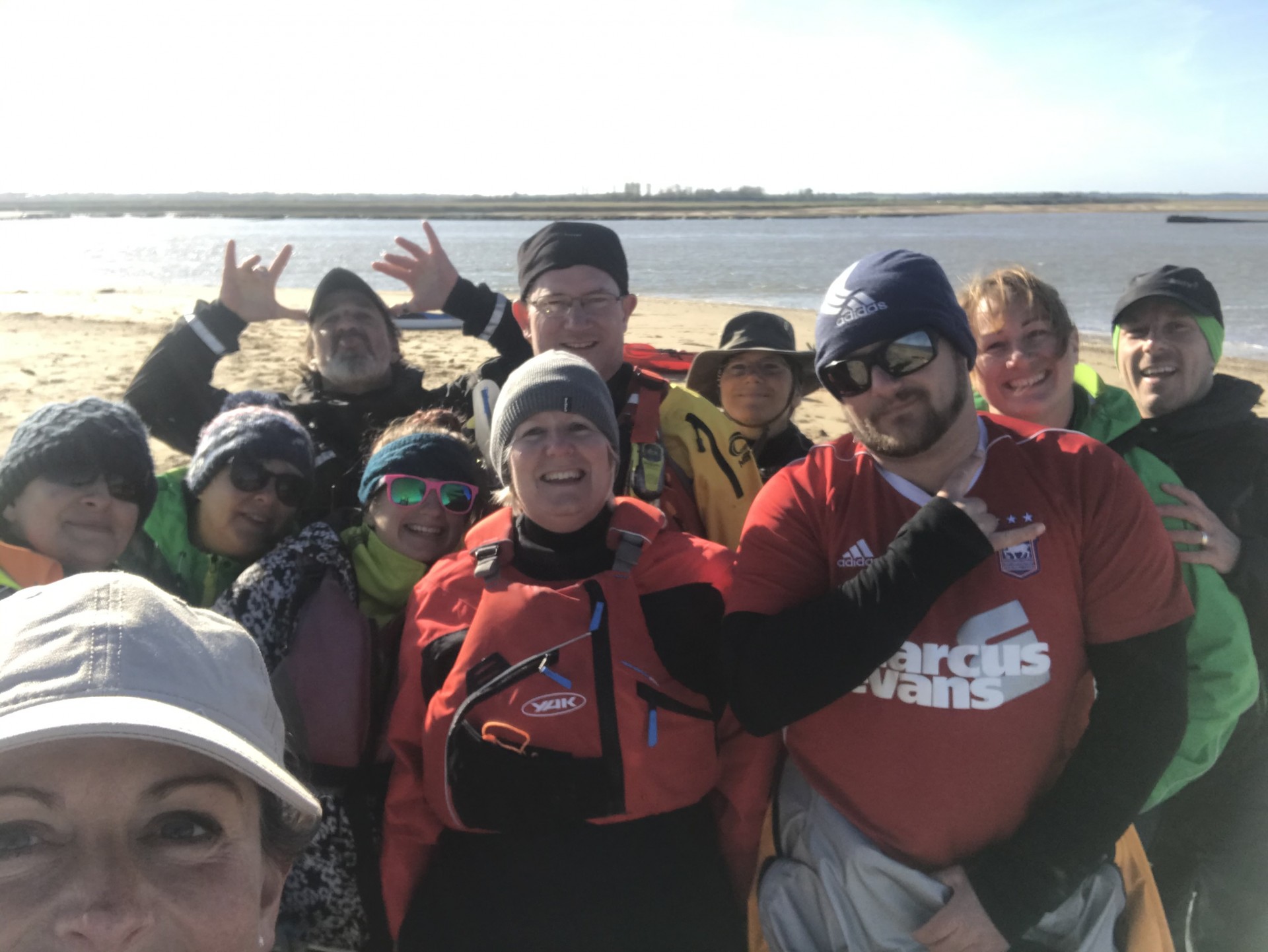 Group of smiling kayaking membership for trips and training courses.