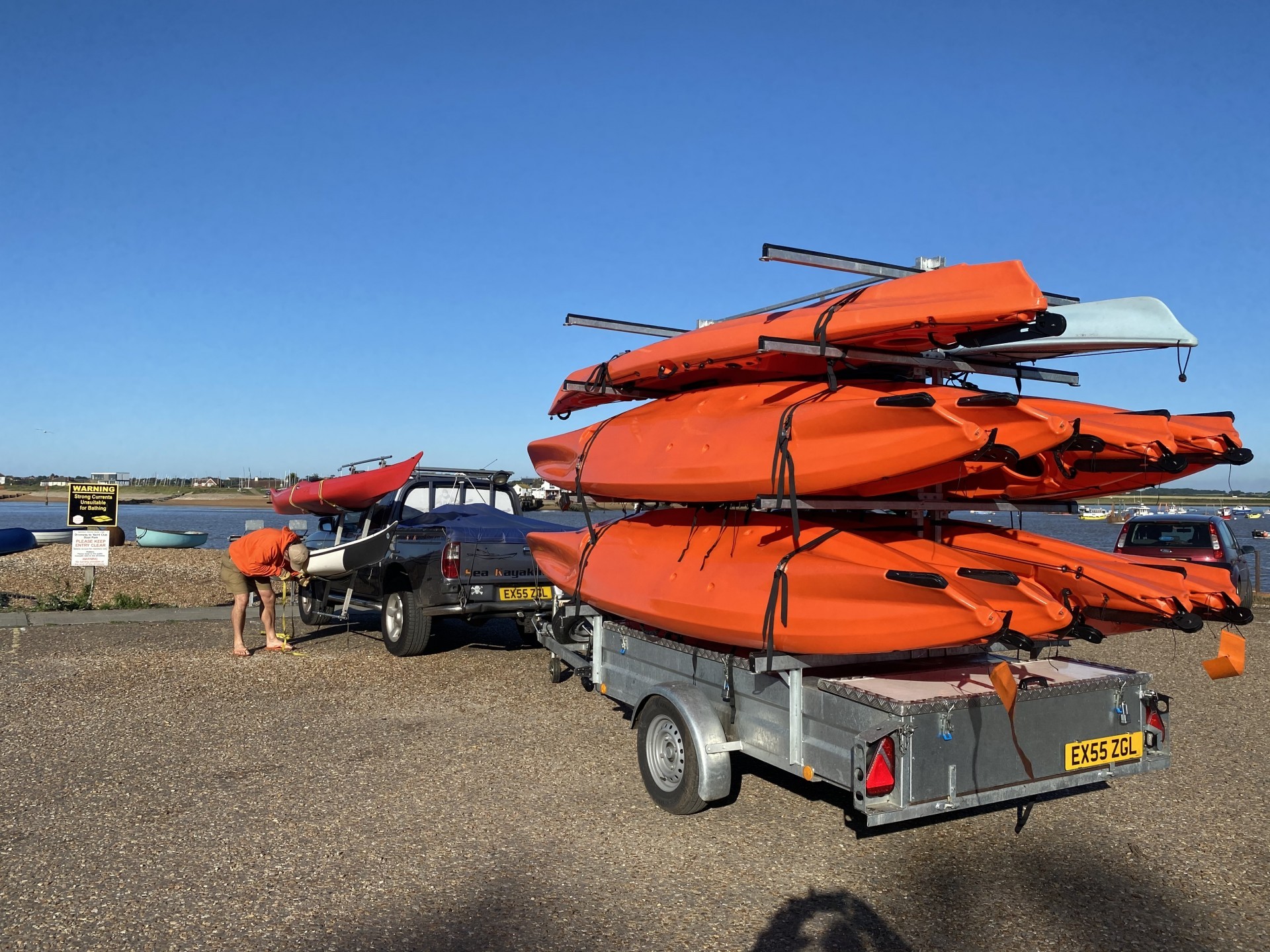 /storage/Guide loading kayaks to a kayak trailer.