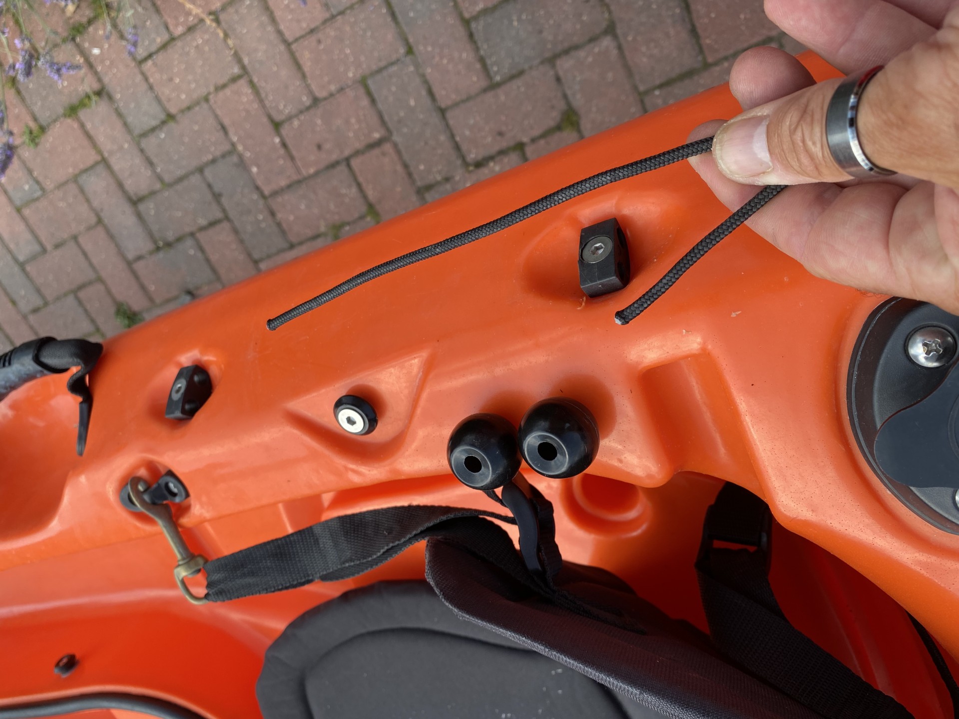 Sit-on-top kayak rudder showing the disconnected ends of the engagement slider and balls.